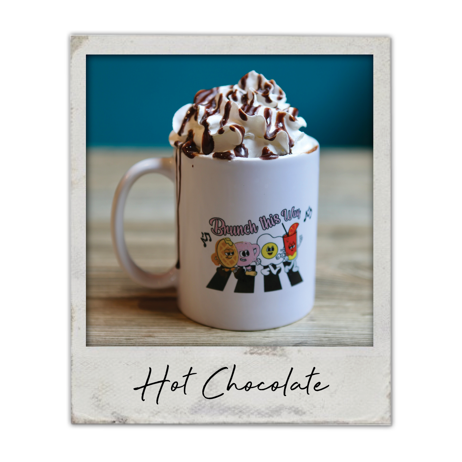 Hot Chocolate | The Breakfast Club USA: A rich hot chocolate topped with whipped cream and chocolate drizzle.
