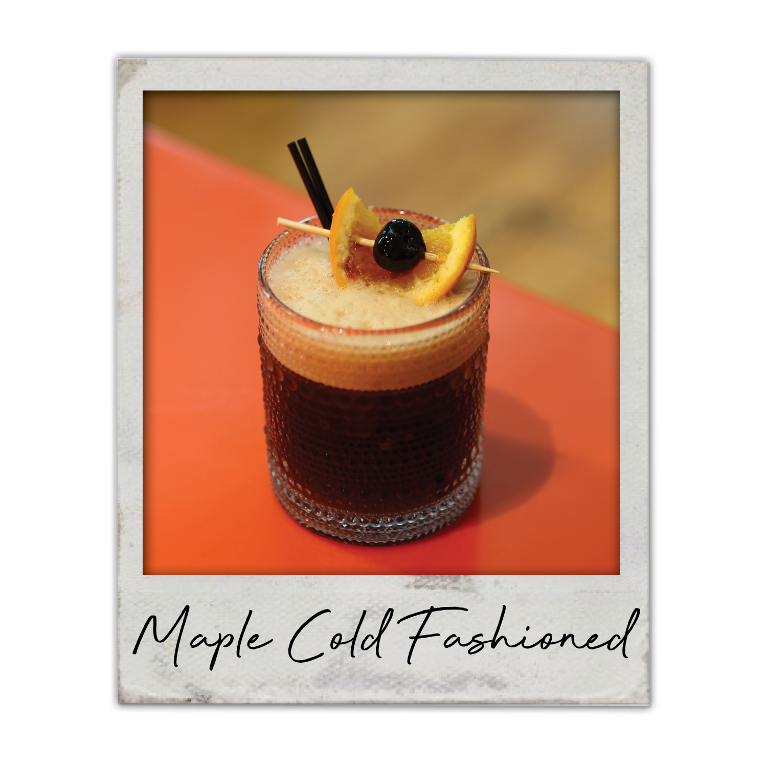 Maple Cold Fashioned | The Breakfast Club USA Metro Des Moines Iowa, A bourbon and cold brew cocktail with maple notes, served over ice with orange garnish.