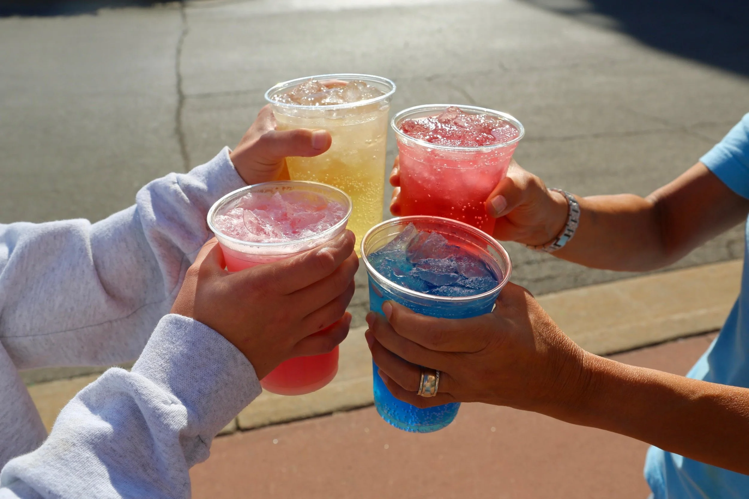 Friends clinking glasses at The Breakfast Club USA Brunch Restaurant in Ankeny, Iowa