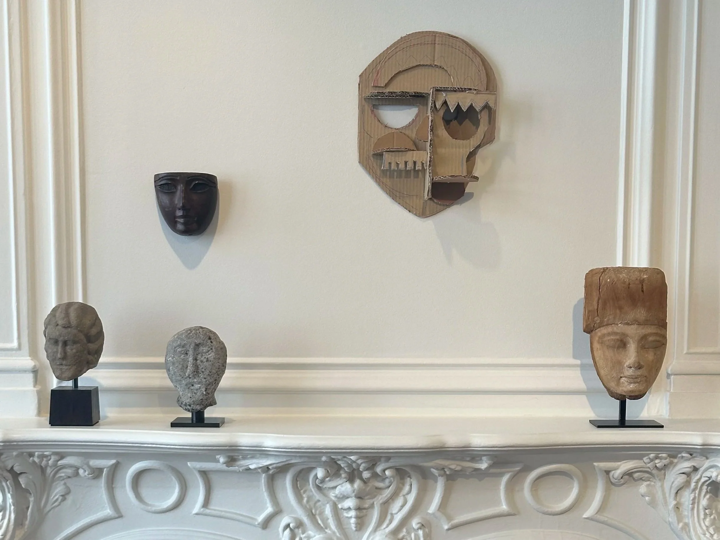 Thomas Houseago's Moon mask displayed with ancient Celtic and Egyptian heads at Lévy Gorvy Dayan