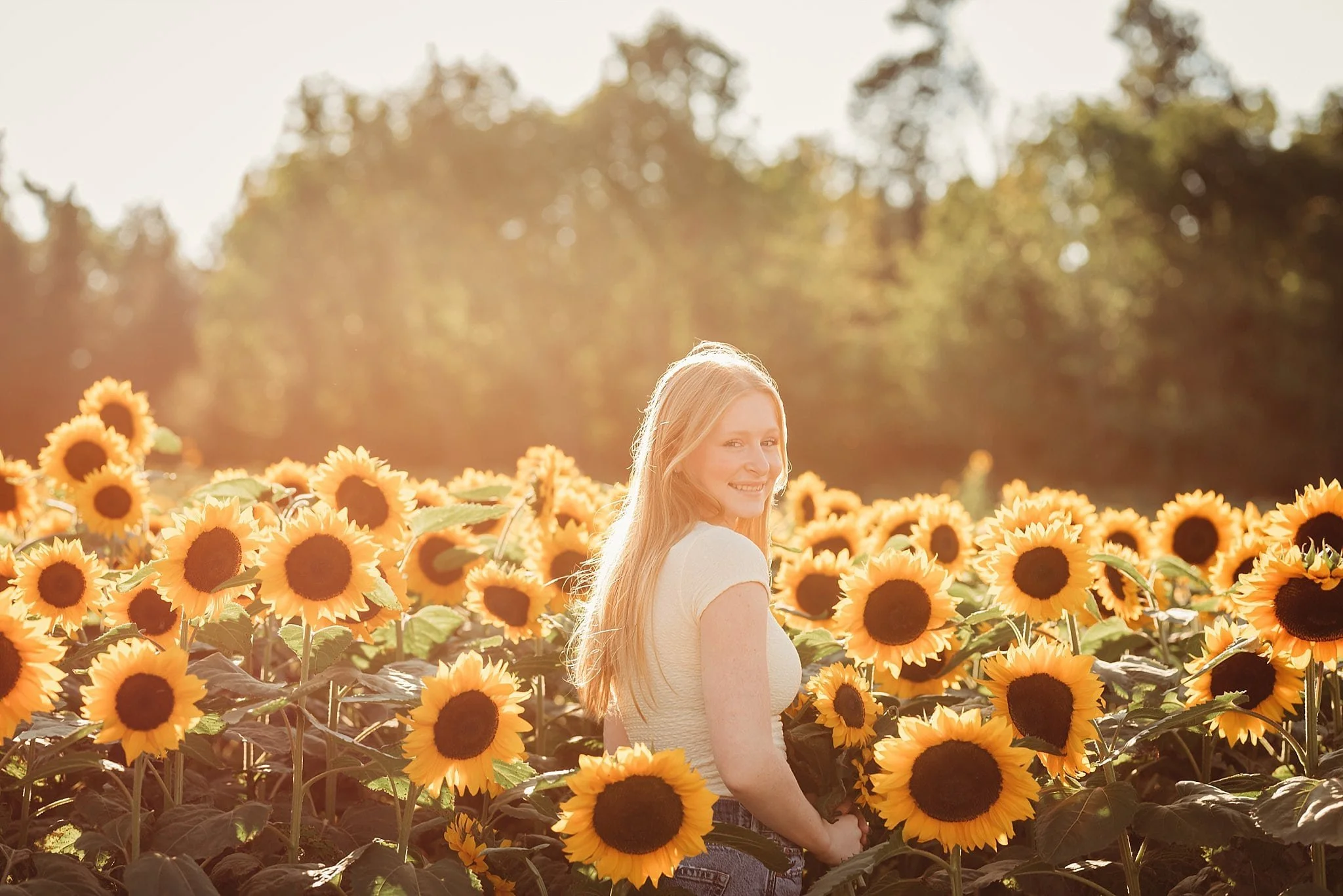 senior-girl-in-field-of-sunflowers.jpg