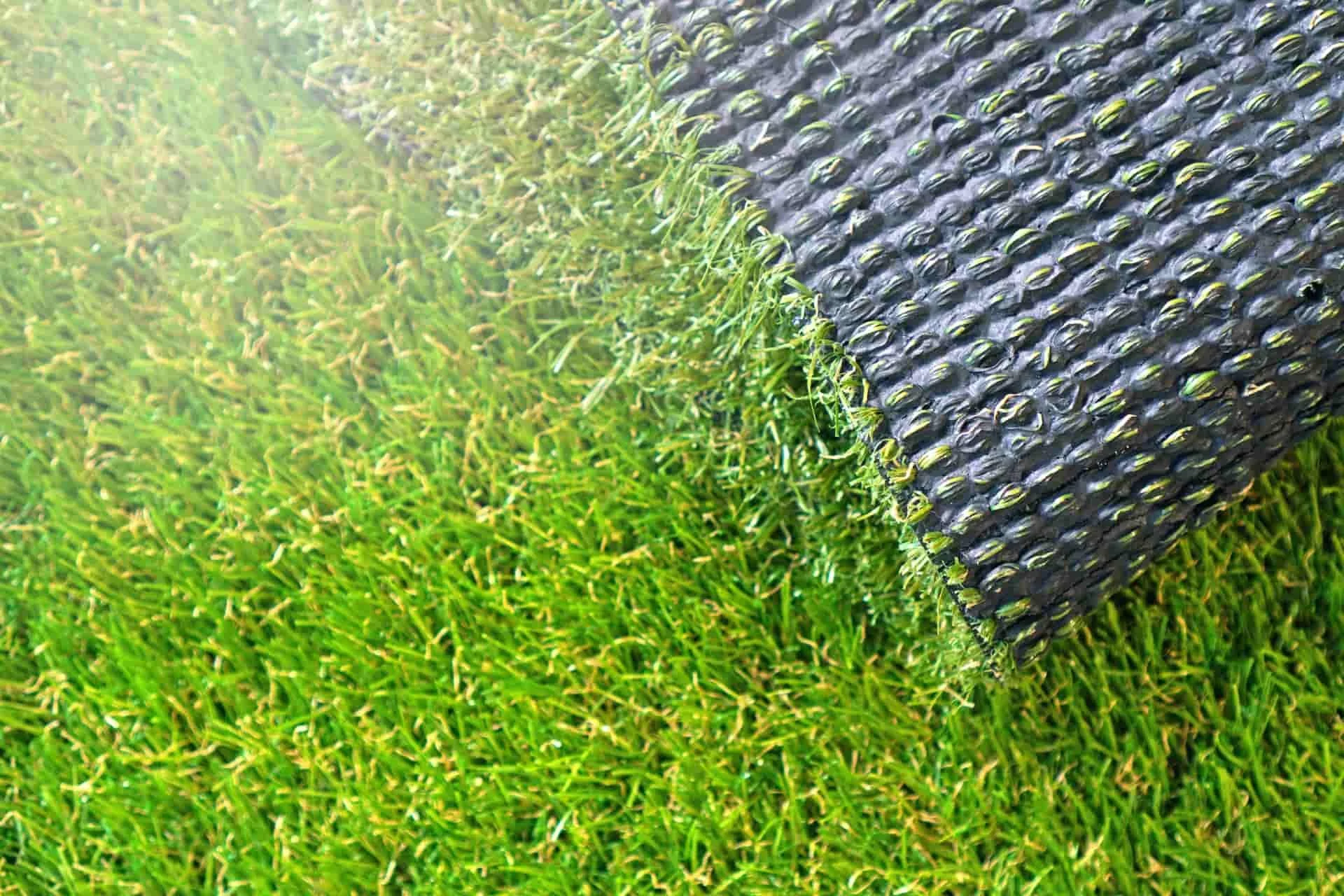 artificial turf getting installed on a lawn