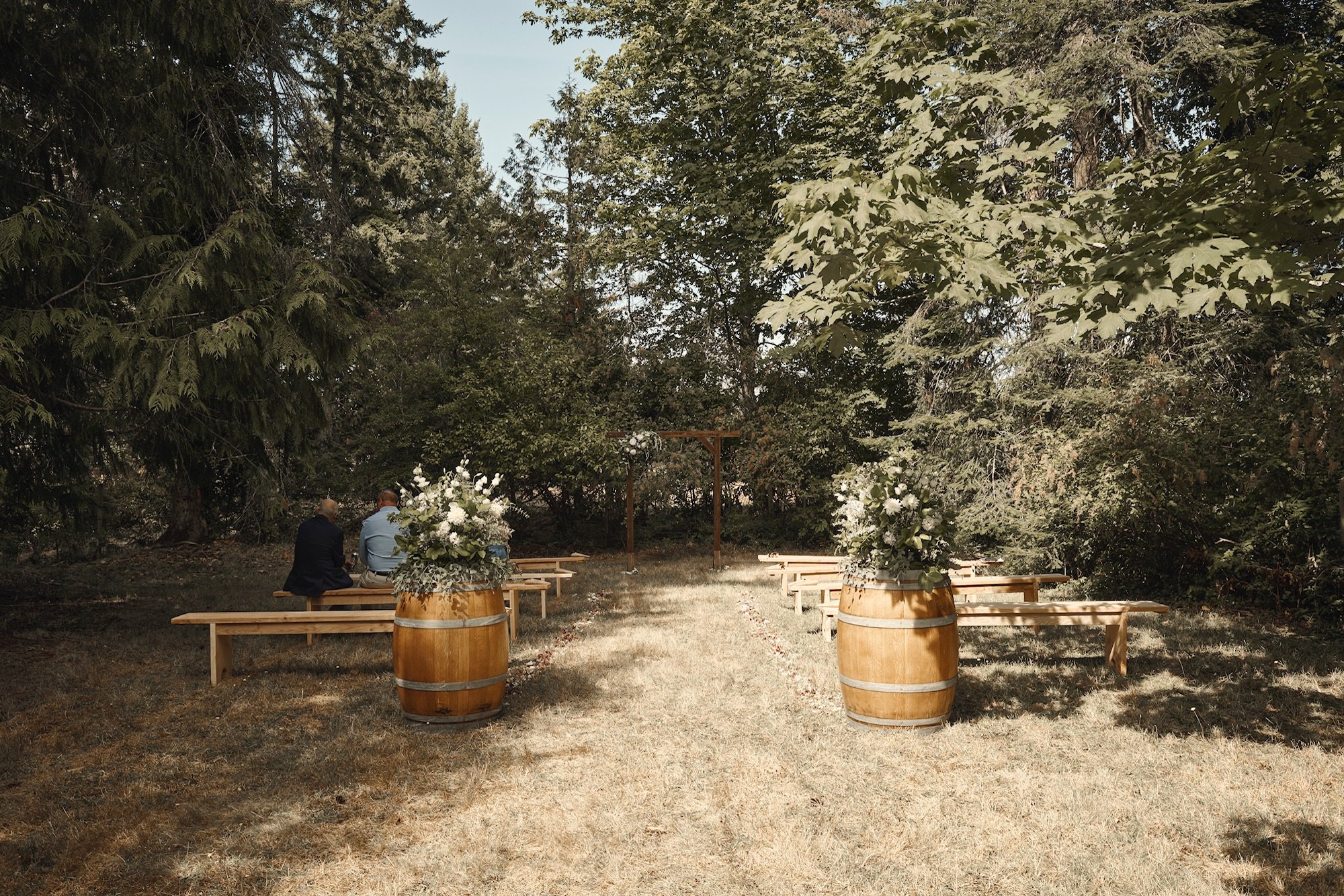 FarmWedding-PatioGardens-VictoriaBC-ceremony-winebarrels-wood-natural-FarmVenue-PondsidePasture.jpg