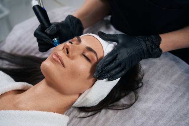 Woman receiving HydrFacial Treatment for hydration at Crystal Gayle Aesthetics