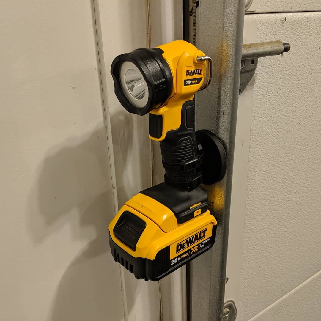 Attached to the garage door track. Ready to go outside at night time.