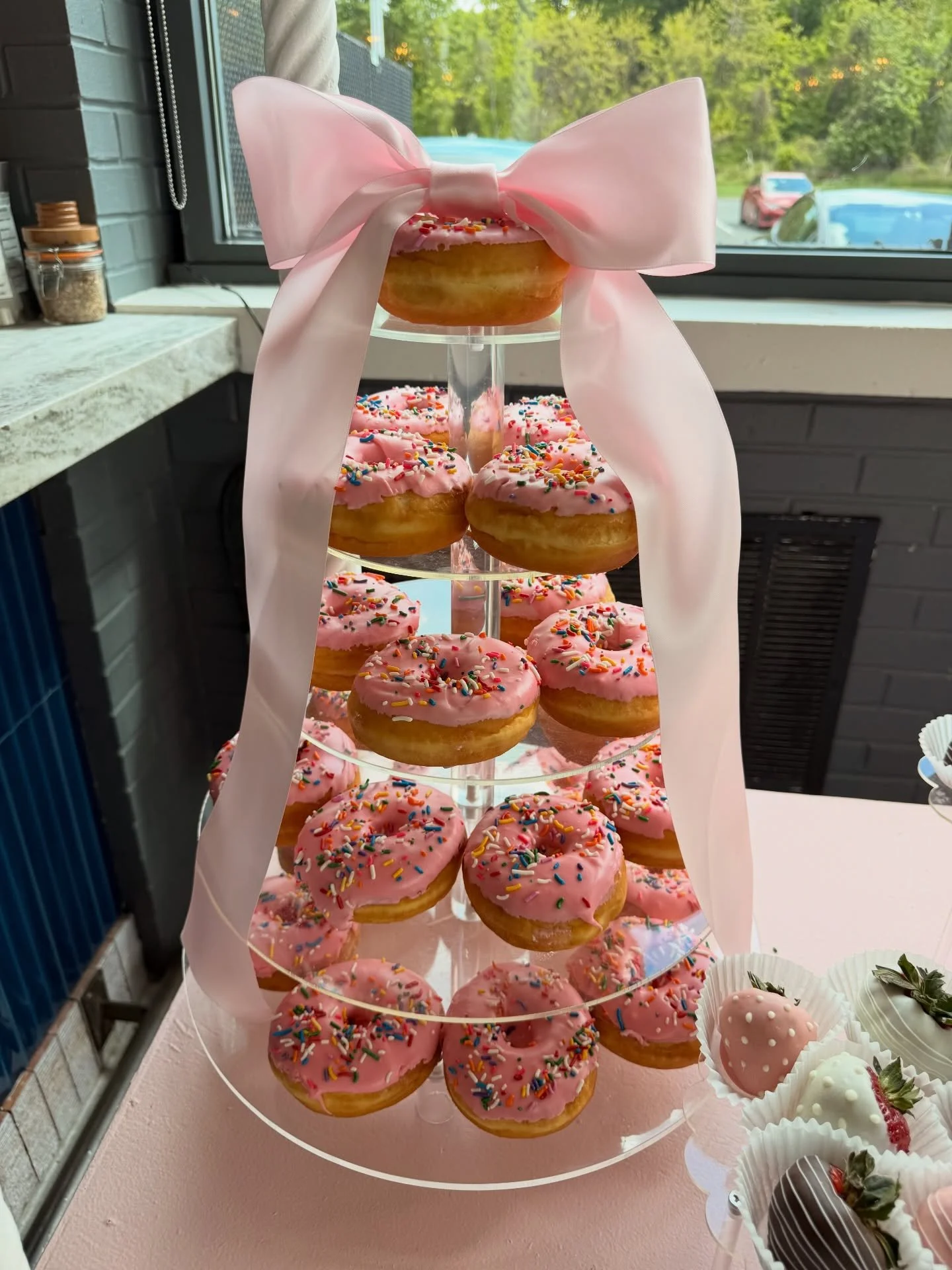 Sweetest setup for the sweetest celebration 💕👶✨

Custom baby shower treats done right &mdash; pink frosted donuts, macarons, cupcakes &amp; chocolate covered strawberries all dressed up and ready to party 🎀

Because every little arrival deserves a