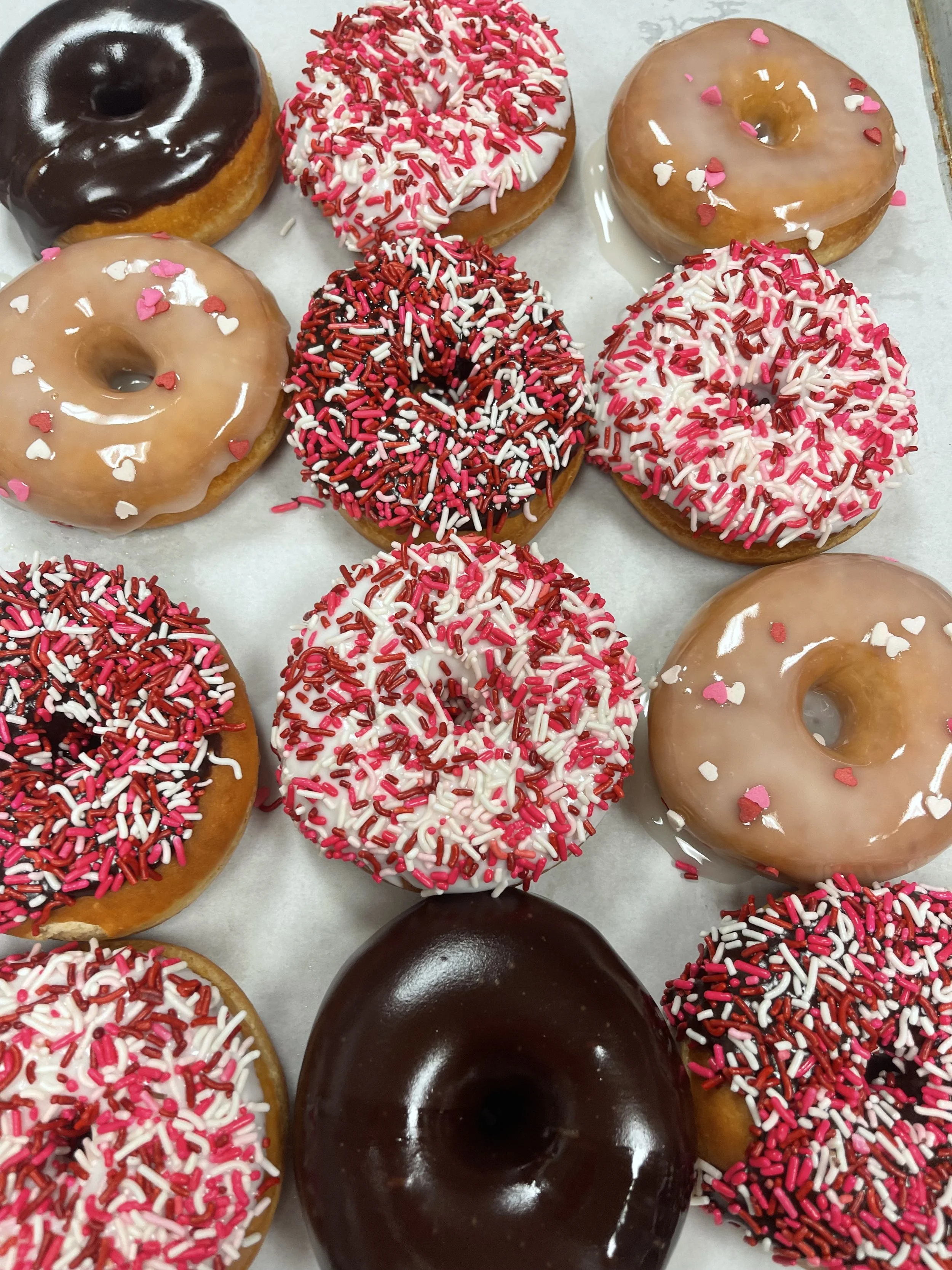 Dozen valentine donuts