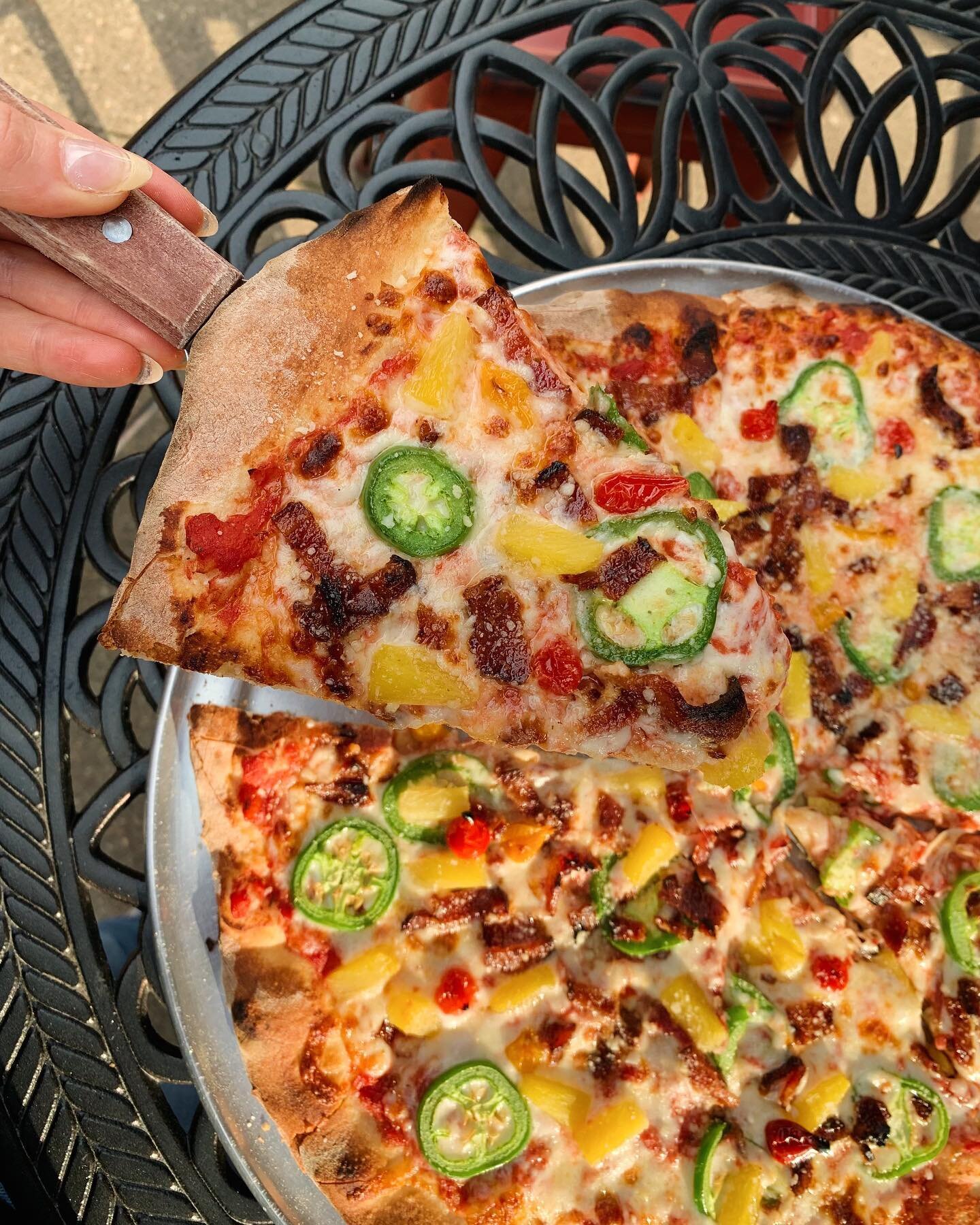 Our NEW, &amp; most controversial pizza yet, 𝐒𝐩𝐢𝐜𝐲 𝐇𝐚𝐰𝐚𝐢𝐢𝐚𝐧 🍍🌴🍕 you either love it or hate it&hellip; but we LOVE it!!! Smothered with pineapple, jalape&ntilde;o, bacon, and sweet pepper drops, it&rsquo;s the perfect combination of sw
