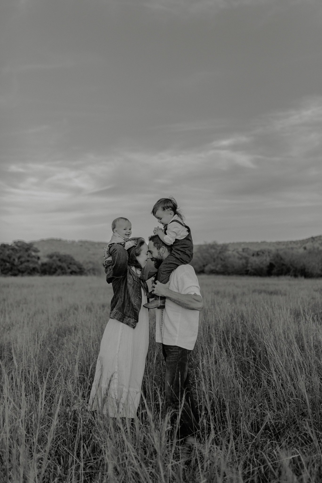Wearing hats for family lifestyle session in an Arkansas field