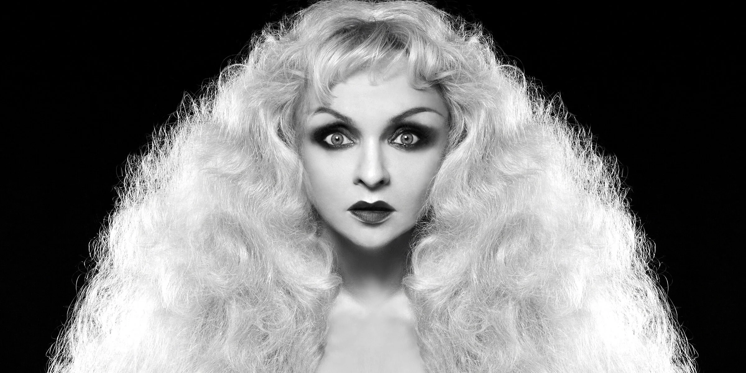 A striking portrait of Julie Atlas Muz, highlighting her as a revolutionary figure in the world of drag and performance art.