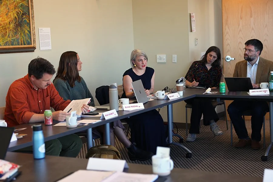 A row of workshop partipants participate around a table - Brian Highsmith, Olivia Paschal, Hiba Hafiz, Margo Pollans, and James Fallows Tierney