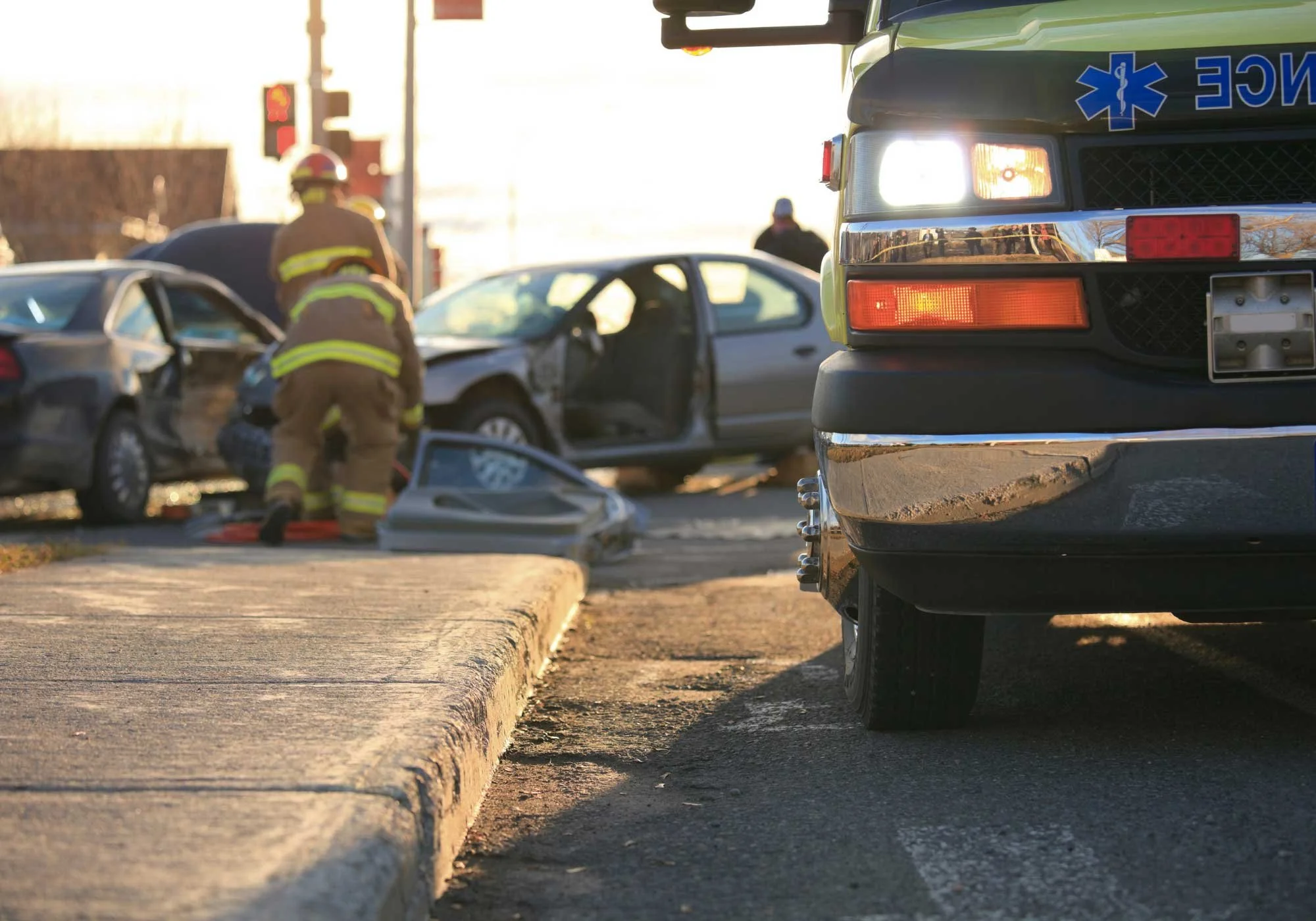 Ambulance and paramedics on the scene of a car crash