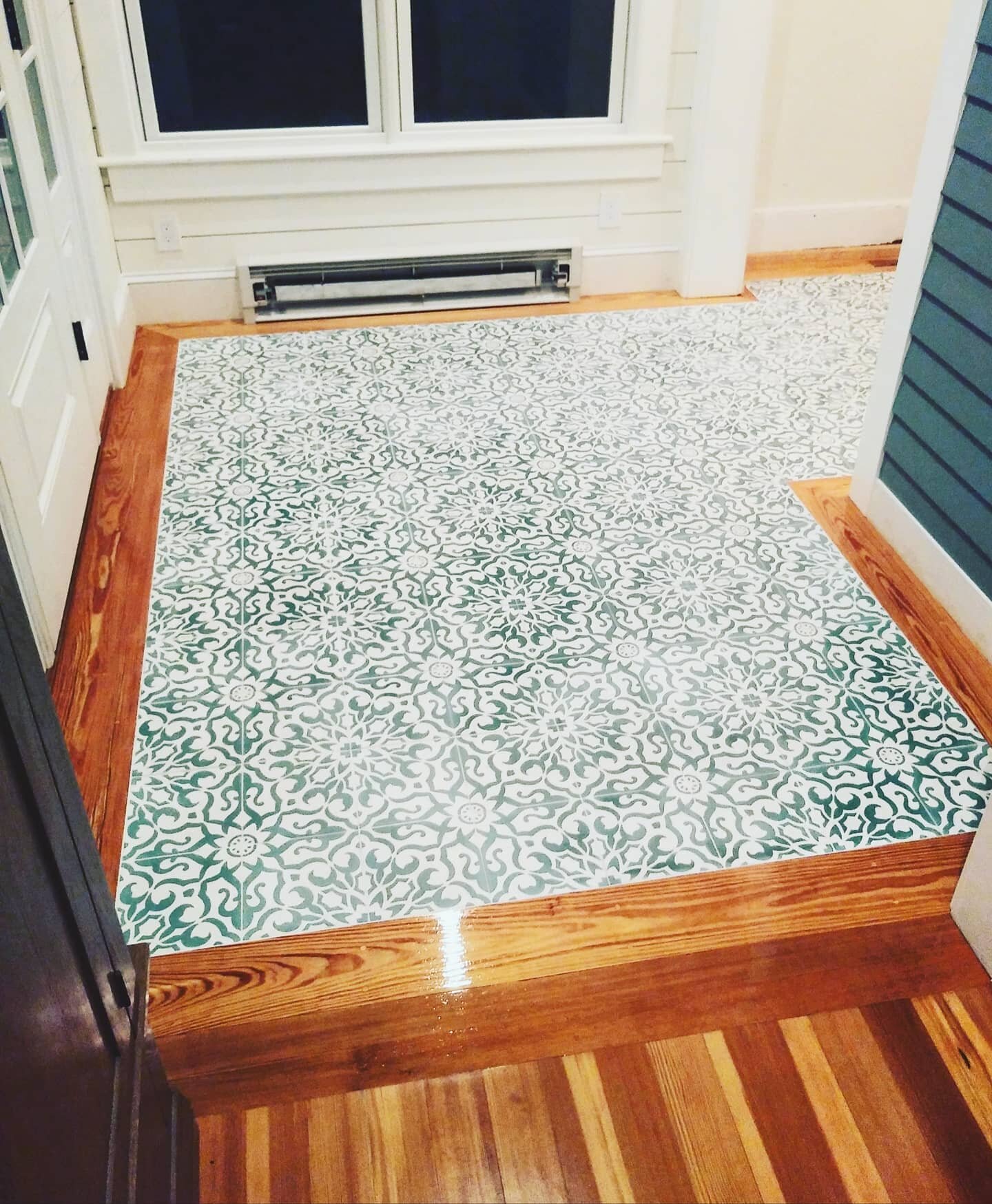 Looking to revamp the entryway of your home? Cement tiles are a fun way to add visual interest. Plus they can handle anything you throw at 'em. 😉 Here, we created a custom wood border using reclaimed lumber. We wanted to match the border to the exis