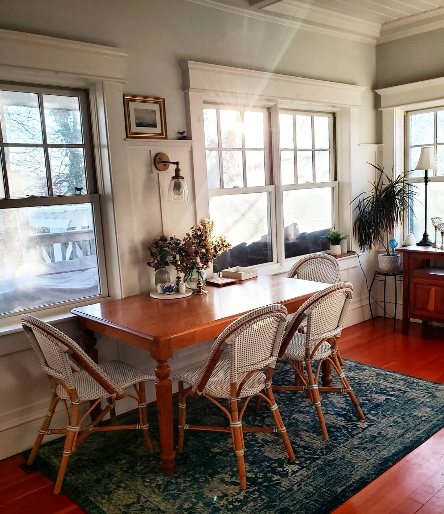 Windows are a great way to transform a dark space into a light, bright one. Here, we turned an awkward room into a dining room by taking out the slider and adding lots of windows and custom moldings. Swipe for the before ==&gt;