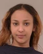  Woman accused of slipping out of handcuffs, kicking officer during arrest, complaint says