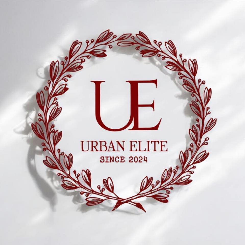 Logo with red laurel wreath surrounding the letters 'UE' and text 'Urban Elite, Since 2024' on a light background.