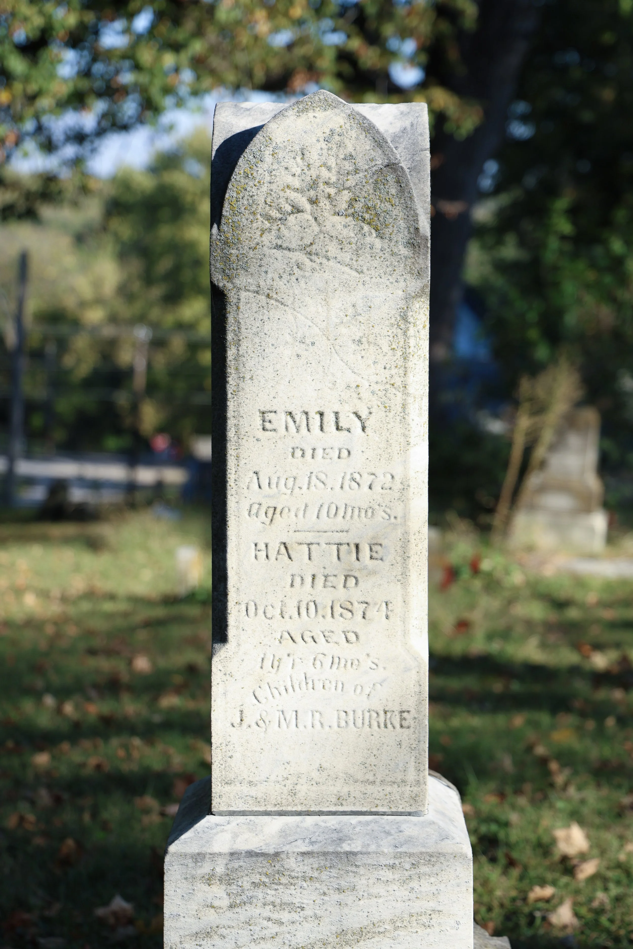 Headstone of the Burke family. Emily died at 10 months in 1872 with her sister, Hattie, dying two years later in 1874 at a year and a half old. Their mother, Mary, also died in 1874 at the age of 30. The father, Josephus, was a building contractor an