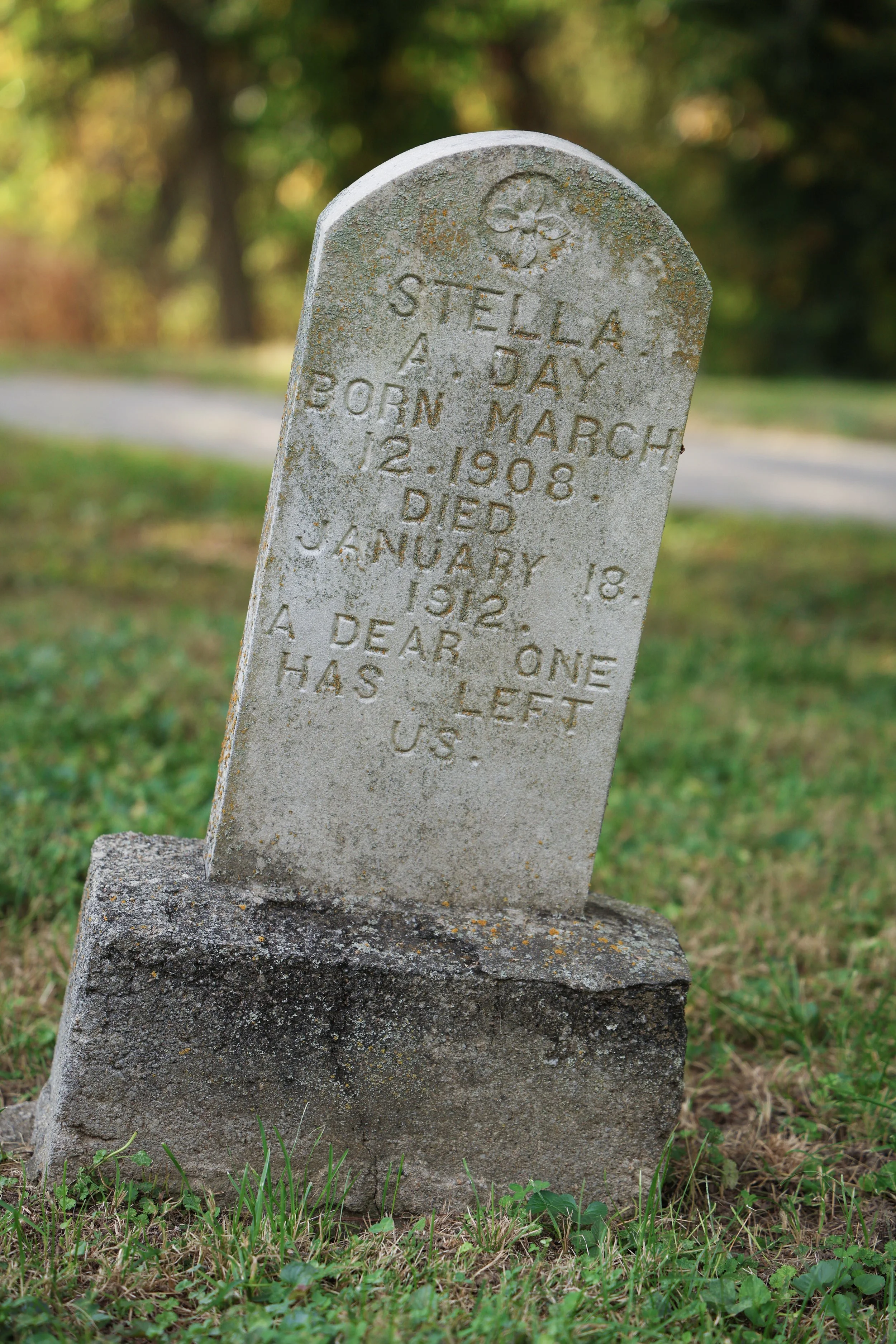 Headstone of 3-year-old Stella. The inscription reads, "A dear one as left us."