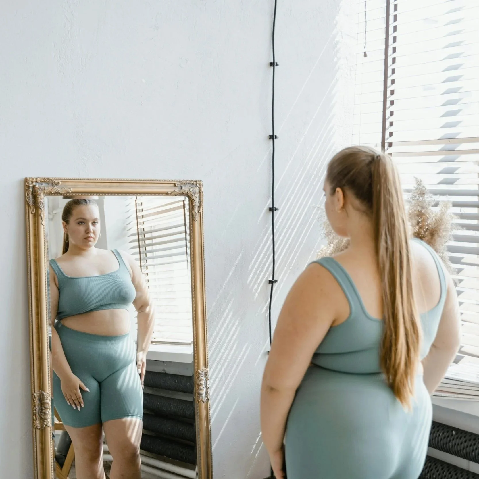Lady looking at herself in the mirror