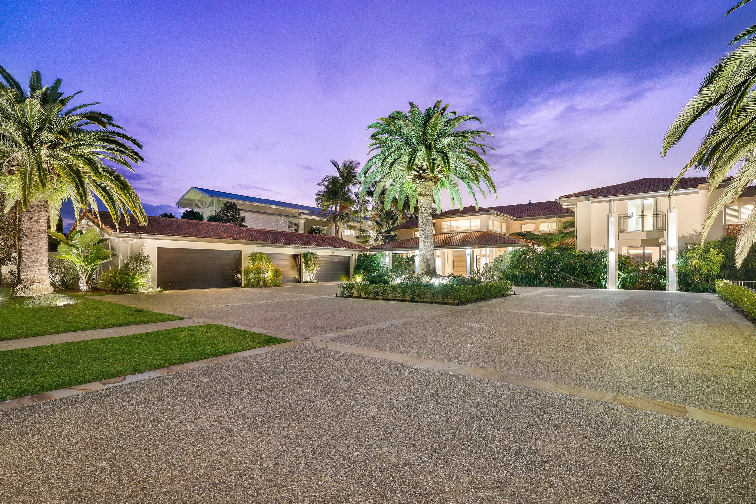 255 Monaco Street, Broadbeach waters. Large Concrete house in Broadbeach Waters, Queensland. Modern Spanish Style with palm trees and large circular driveway entrance