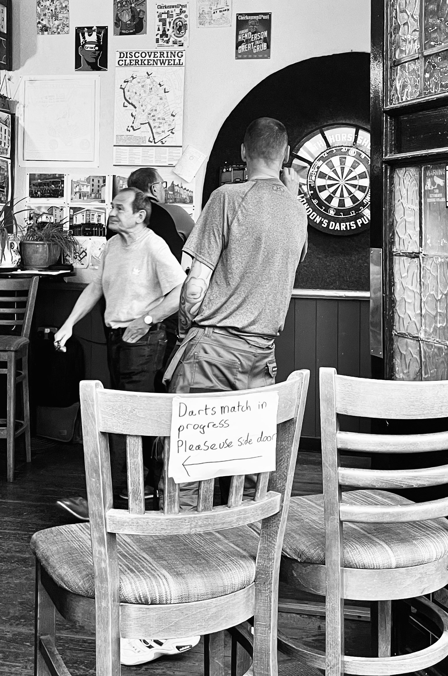 T. Barrington. 35-65. The Horseshoe pub, Clerkenwell Close. One of the regular darts matches held here.
