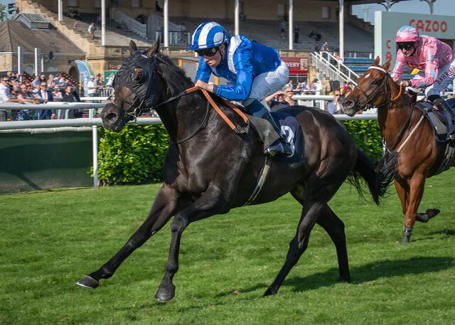 Khaadem winning the Scarbrough Stakes at Doncaster under William Buick