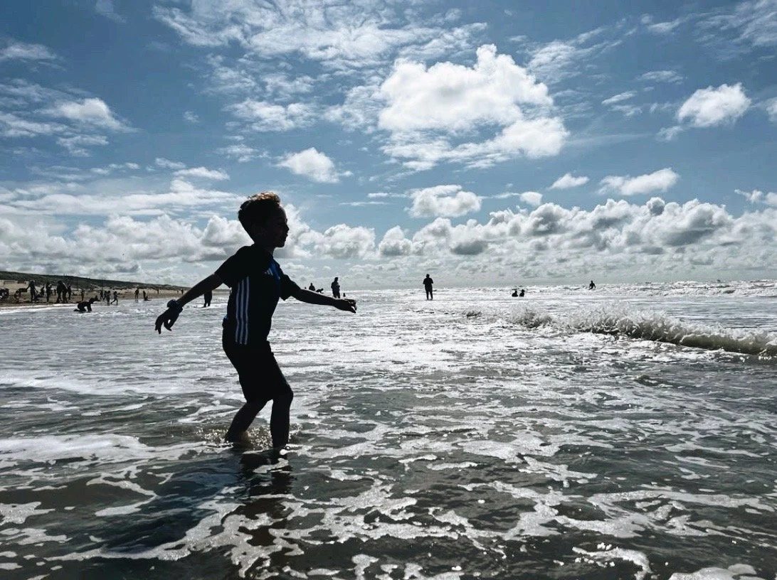 kid splashing in the sea