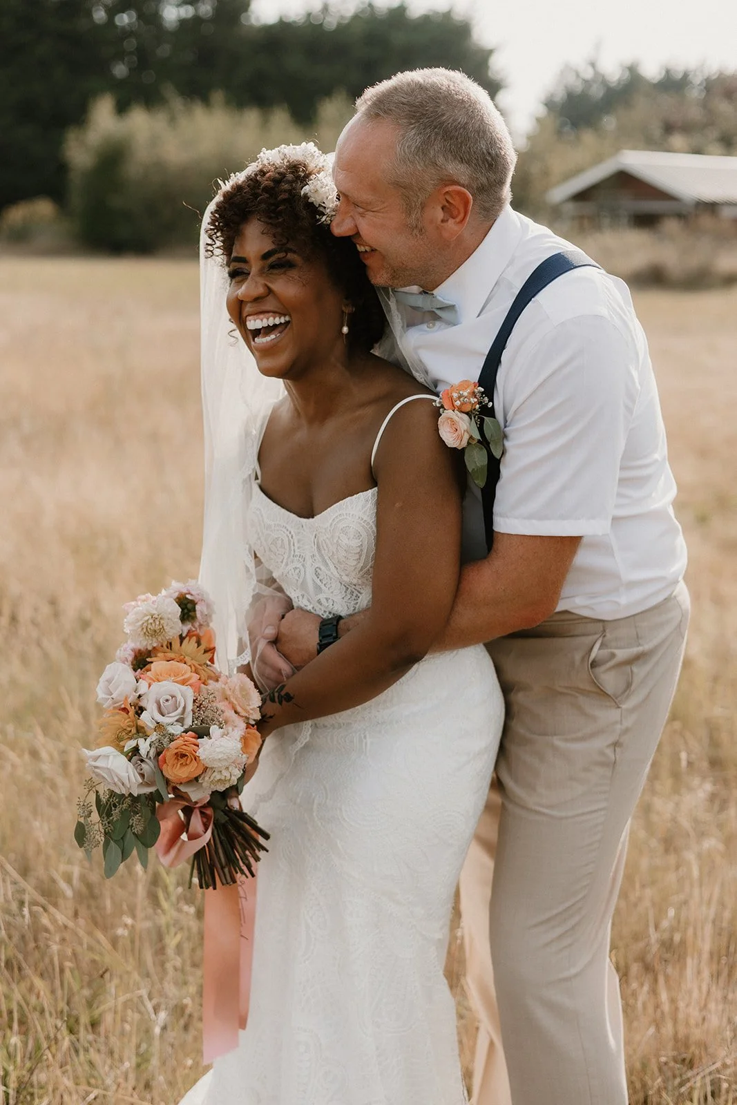 Couple cuddling in a field