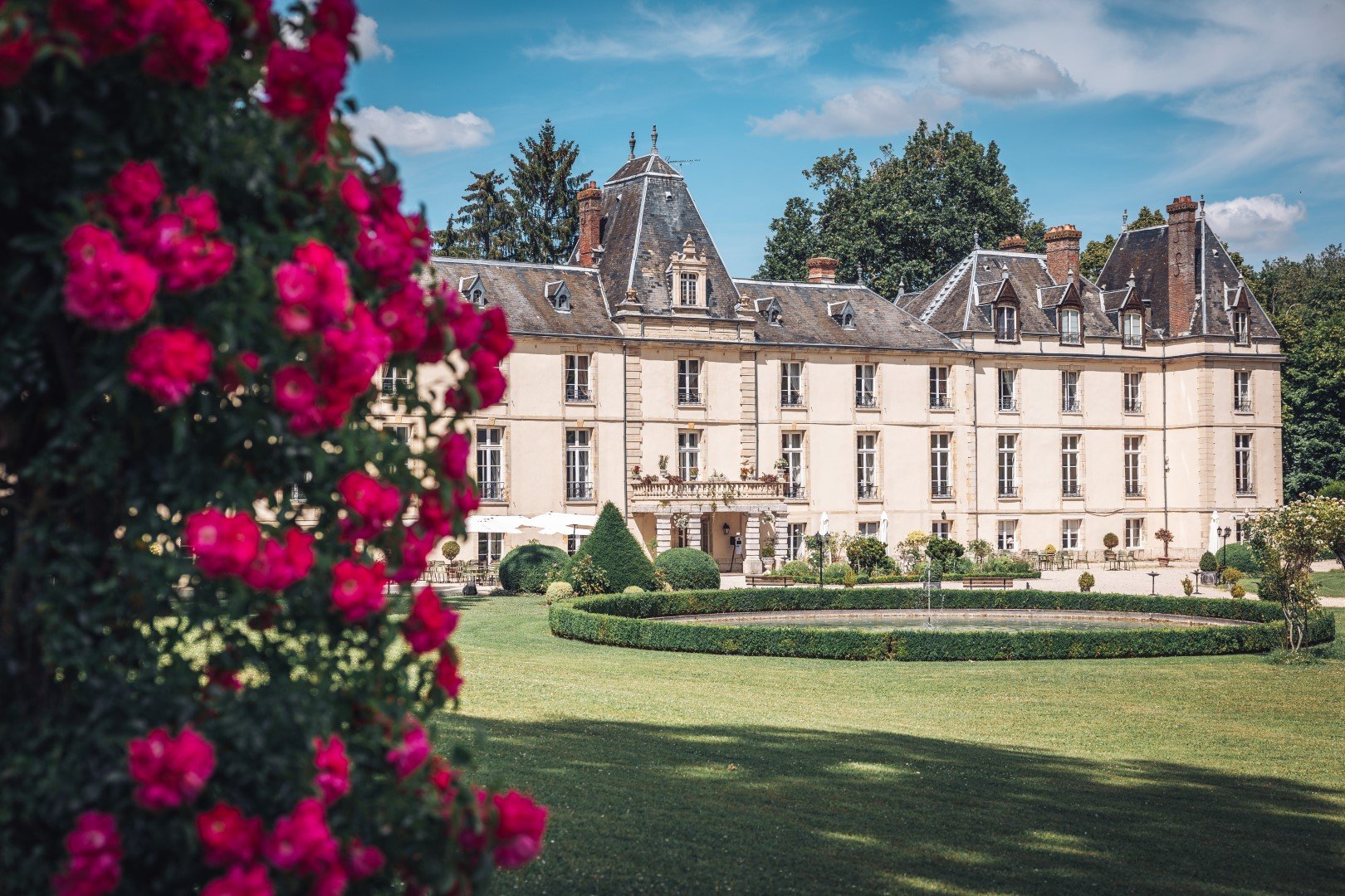 Country view of the château and flowers in the garden 