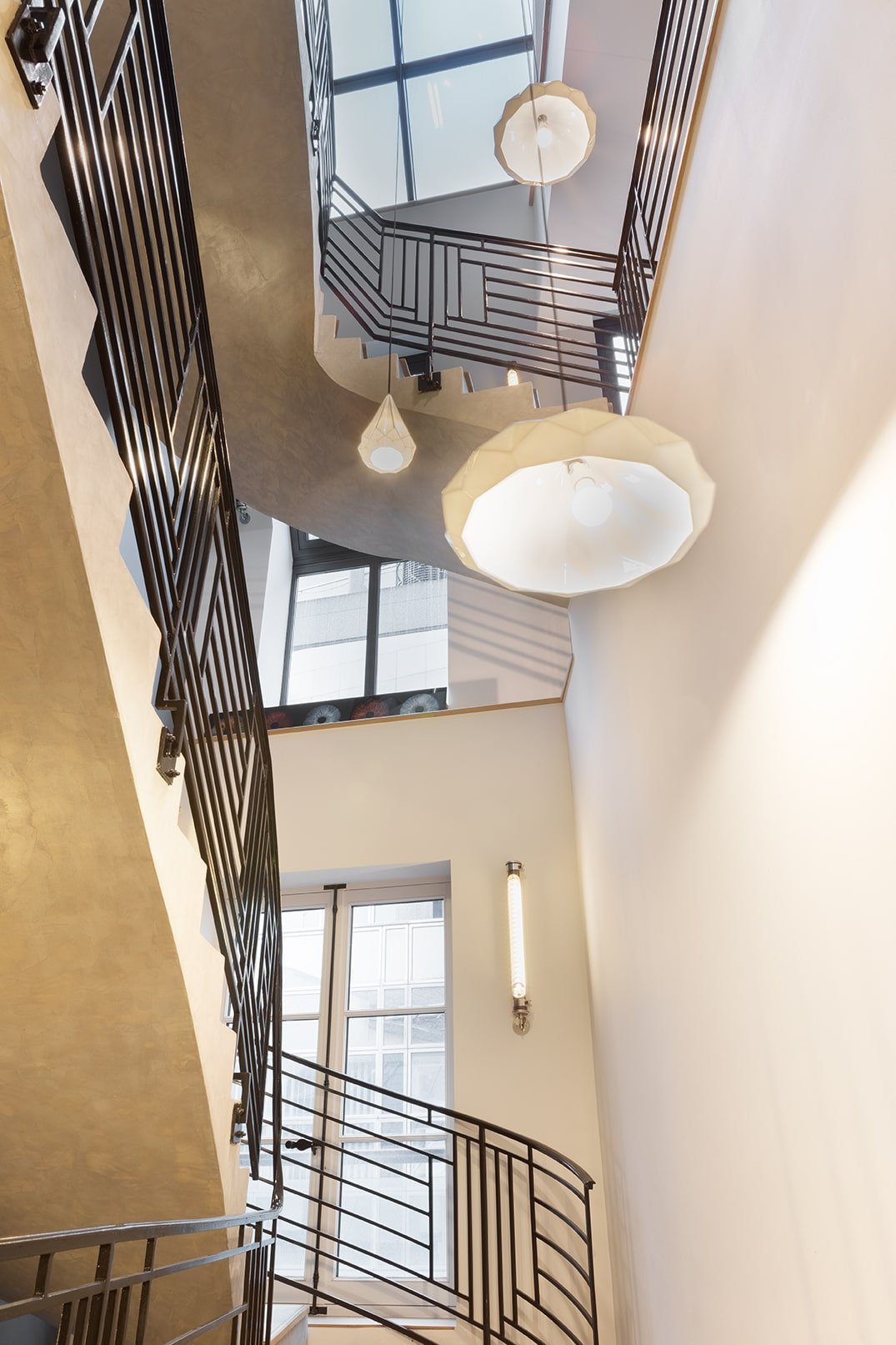 penthouse rental staircase with light fixtures 