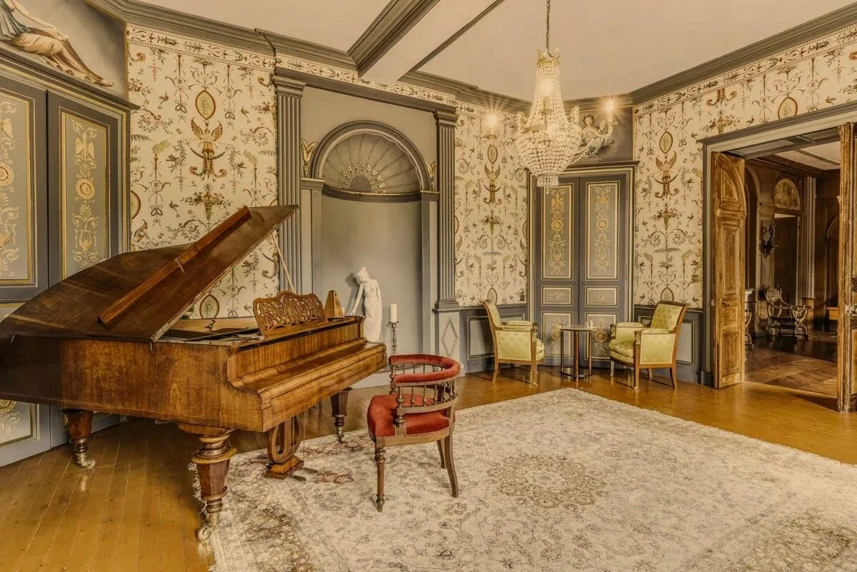 Music+Room+Grand+Piano+With+Chess+Set+Area+-+Chateau+De+Vezins.jpg