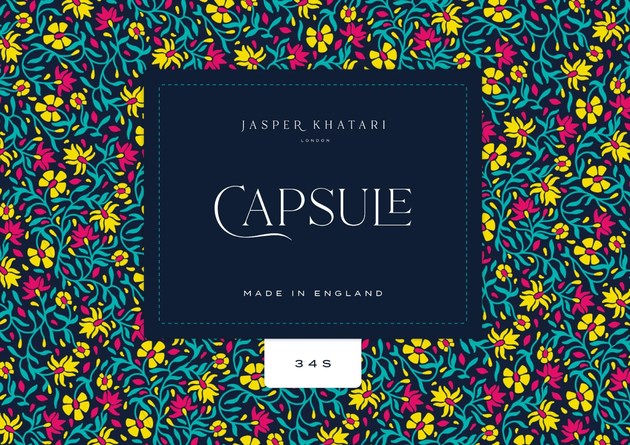 In contrast to the white background used for bespoke suit labels, the "Capsule" collection uses a navy background for the woven label.