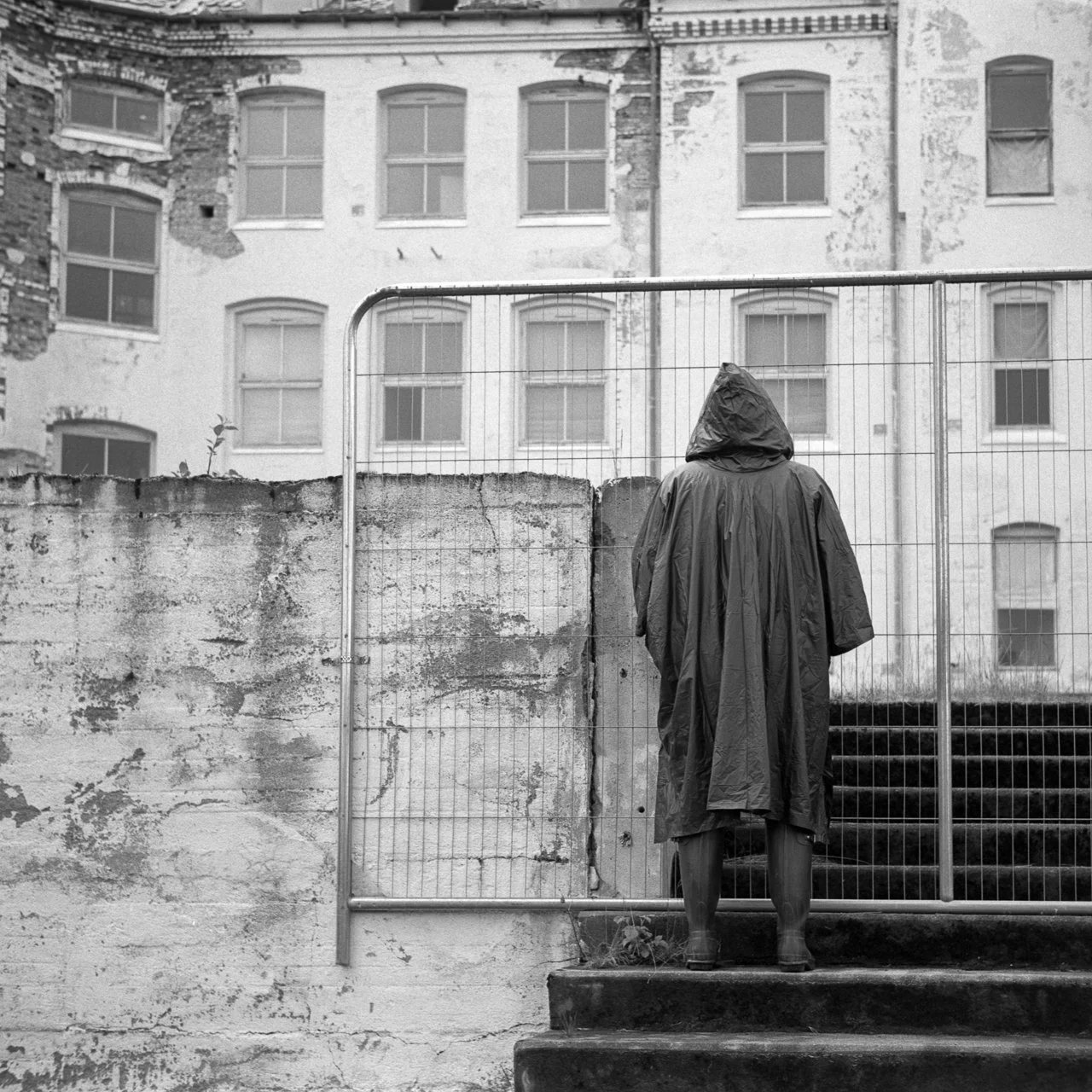 A photo sequence from Luster Sanatorium, capturing a journey through isolation and timeless decay, from organic surroundings to the final confrontation with the wall.
