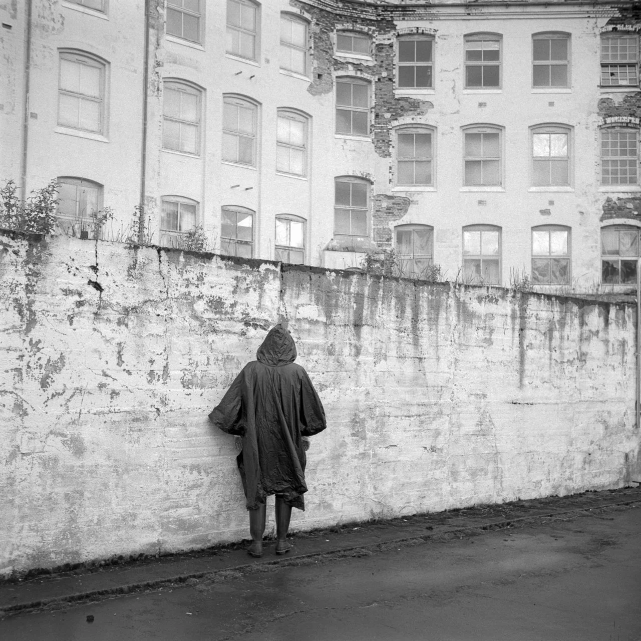 A photo sequence from Luster Sanatorium, capturing a journey through isolation and timeless decay, from organic surroundings to the final confrontation with the wall.