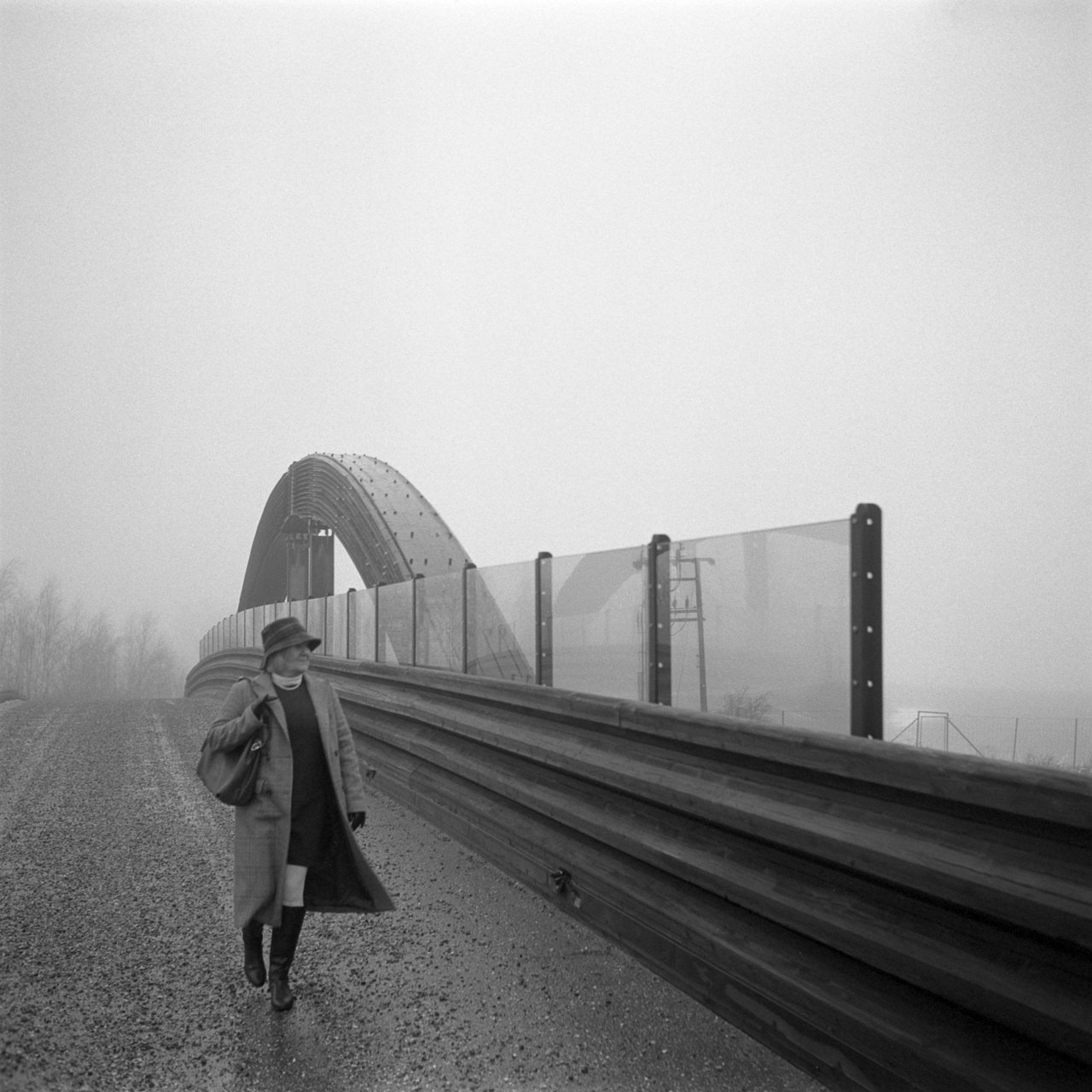 Elisabeth is walking over a bridge at Soli in Østfold, Norway