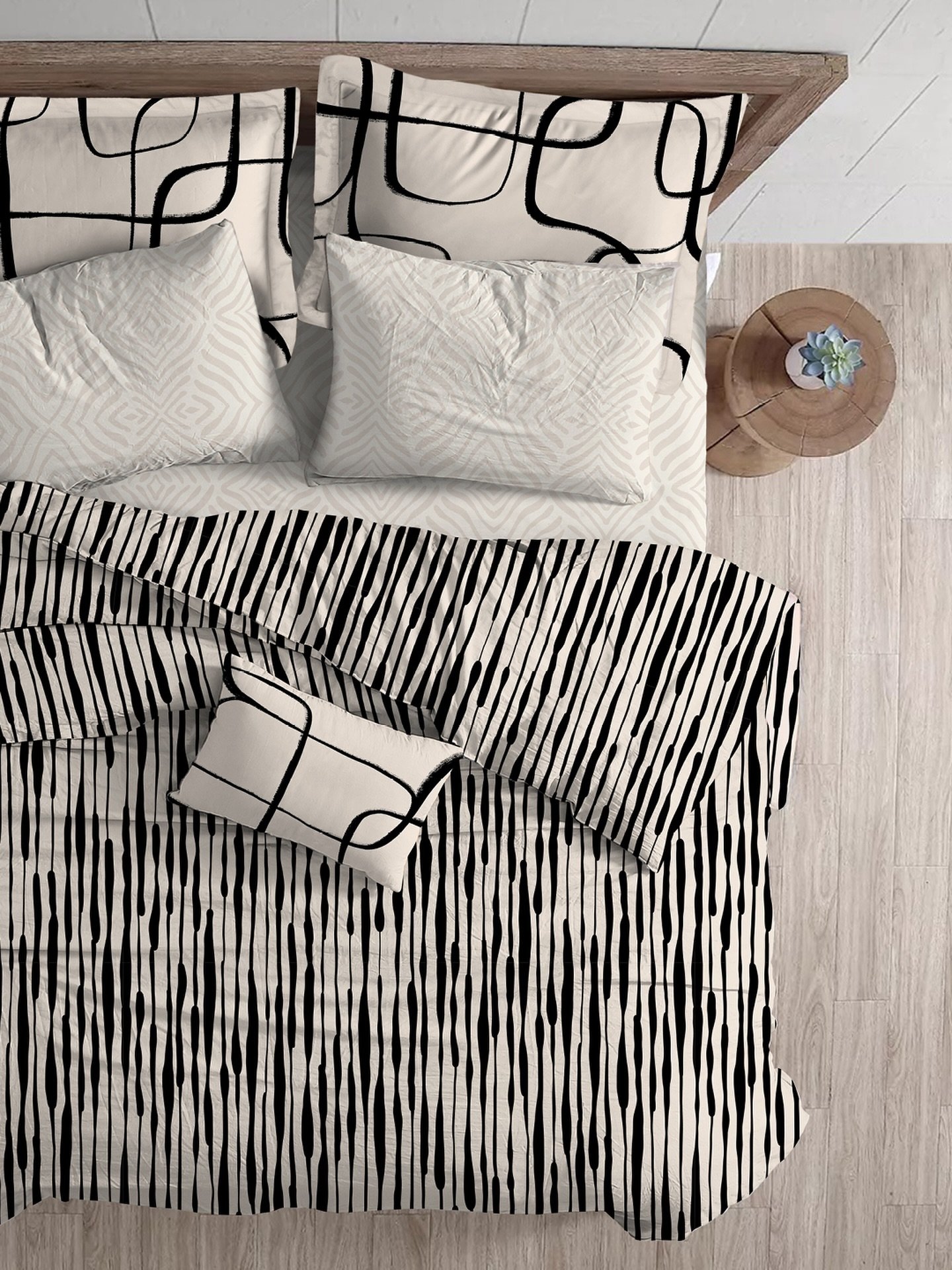 Spoonflower bedding from my Black and Vanilla collection. 👌 Pair Inky Stripes duvet cover with Native Lines Cream sheet set and Intersections flanged edge pillow shams. 😉

Shop the collection here:
https://www.spoonflower.com/en/collections/785855-