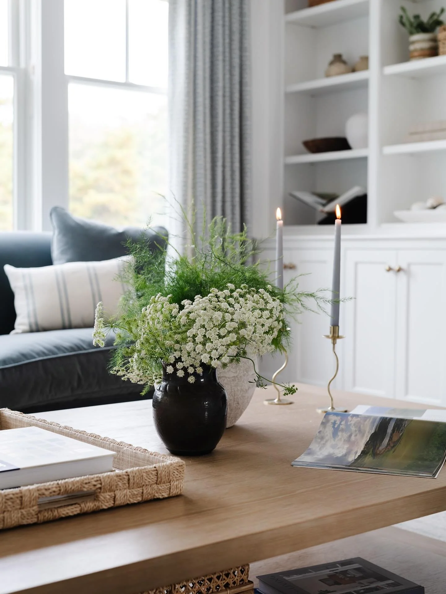 Moments like this with fresh greenery, lit candles and inspiring reads is where the magic lies. 

. . . 

Design &amp; Styling: @houseofcocointeriors 
Photography: @jessicadelaneyphotography 

Living Room Design, Living Room Inspo, New England Design