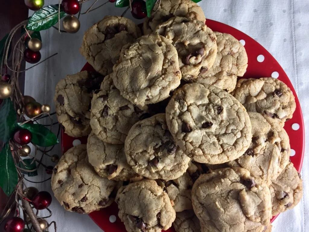Red Plate filled with Brown butter chocolate chip cookies