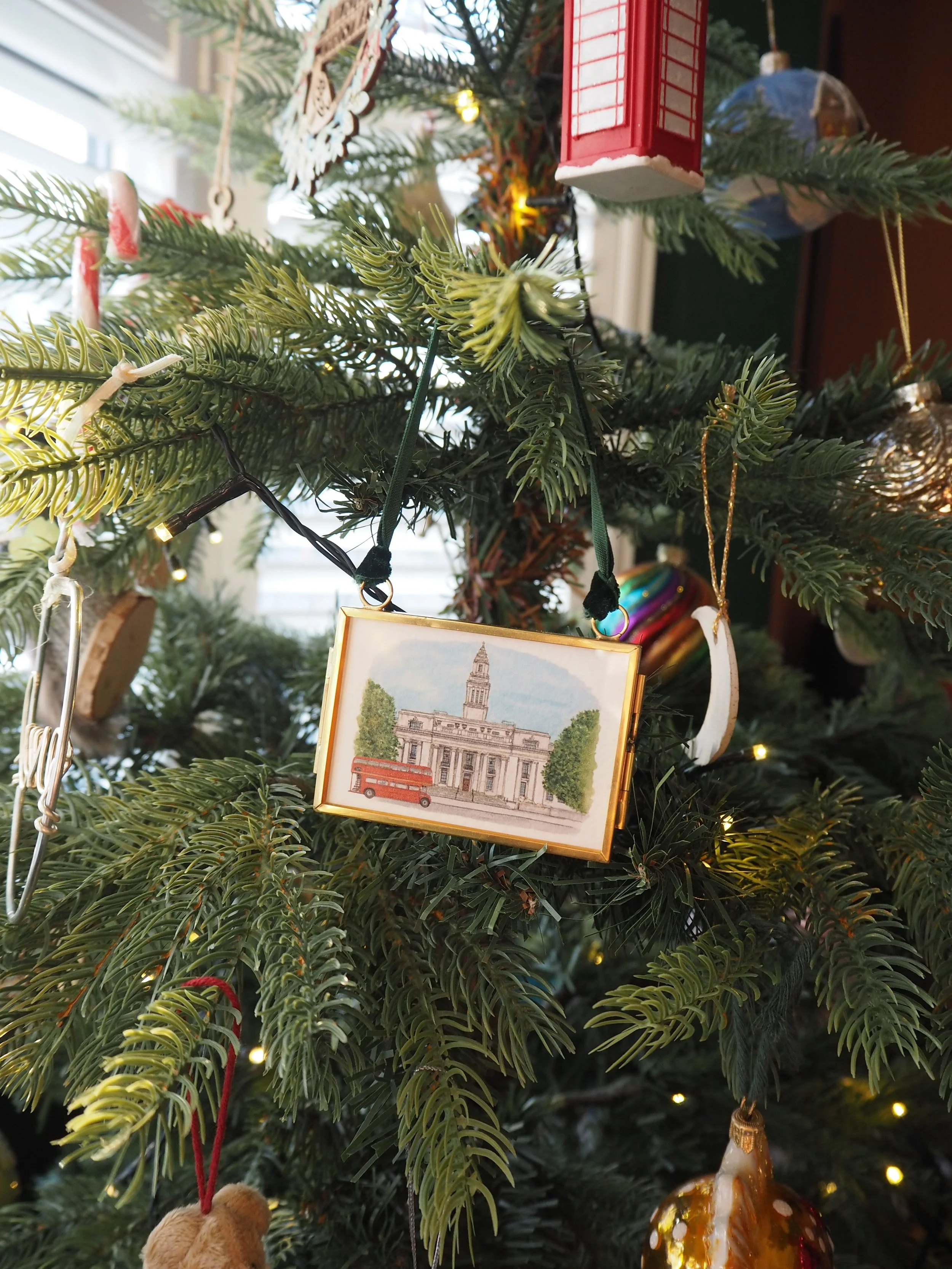 a small hanging frame christmas tree decoration featuring a watercolour illustration of Old Marylebone Town Hall