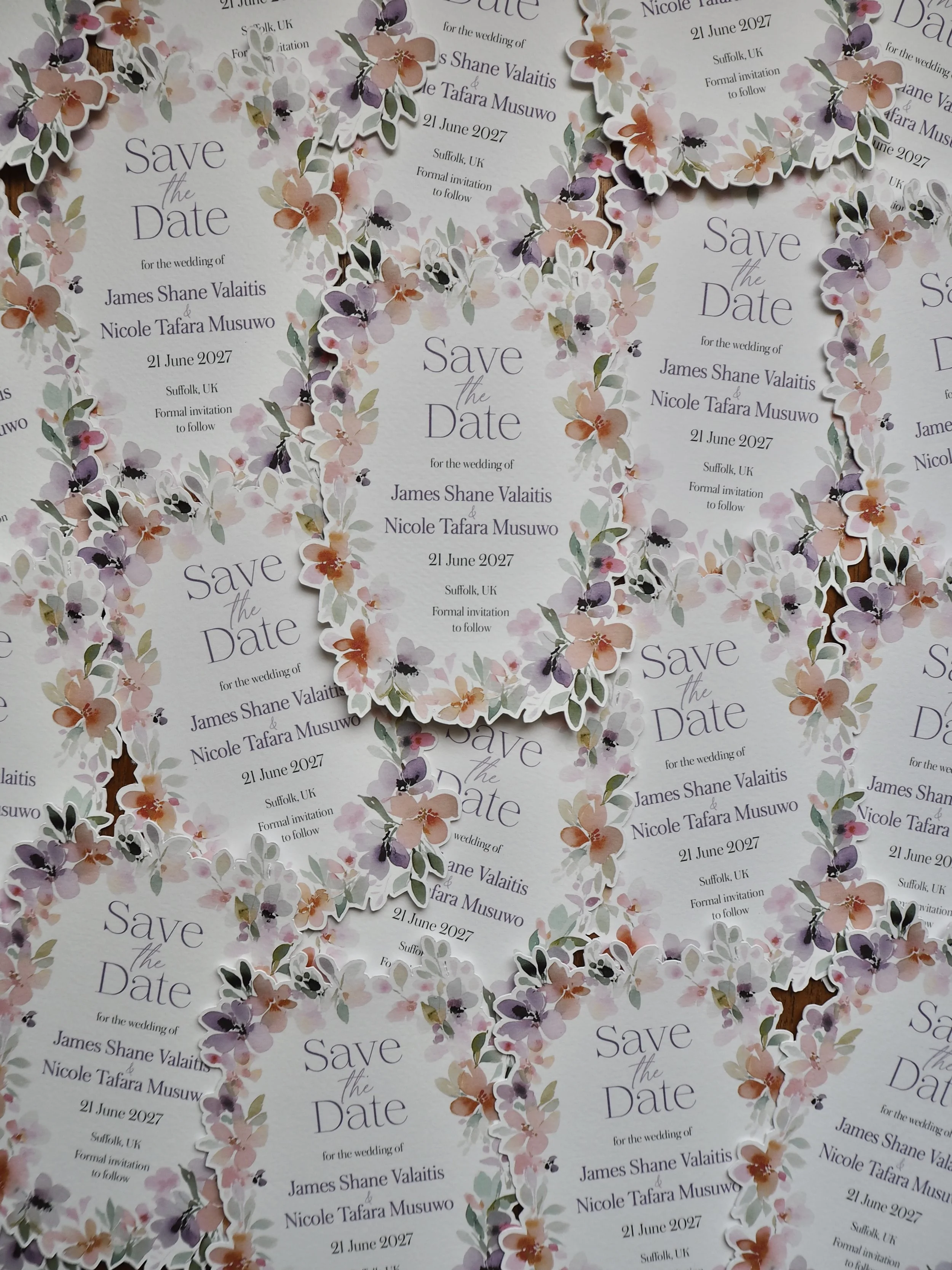 A floral die-cut save the date card