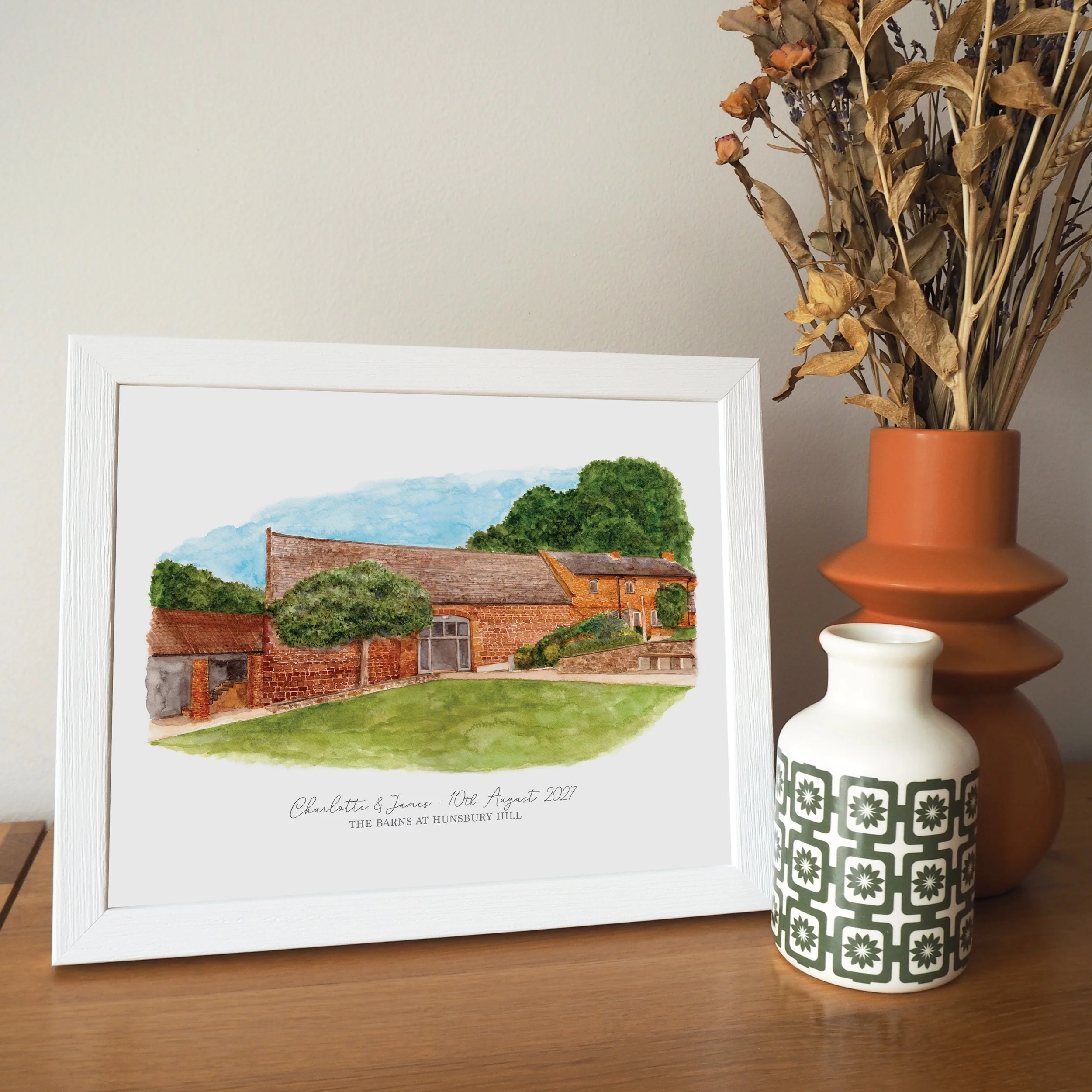 a framed personalised print of a watercolour illustration of wedding venue The Barns at Hunsbury Hill
