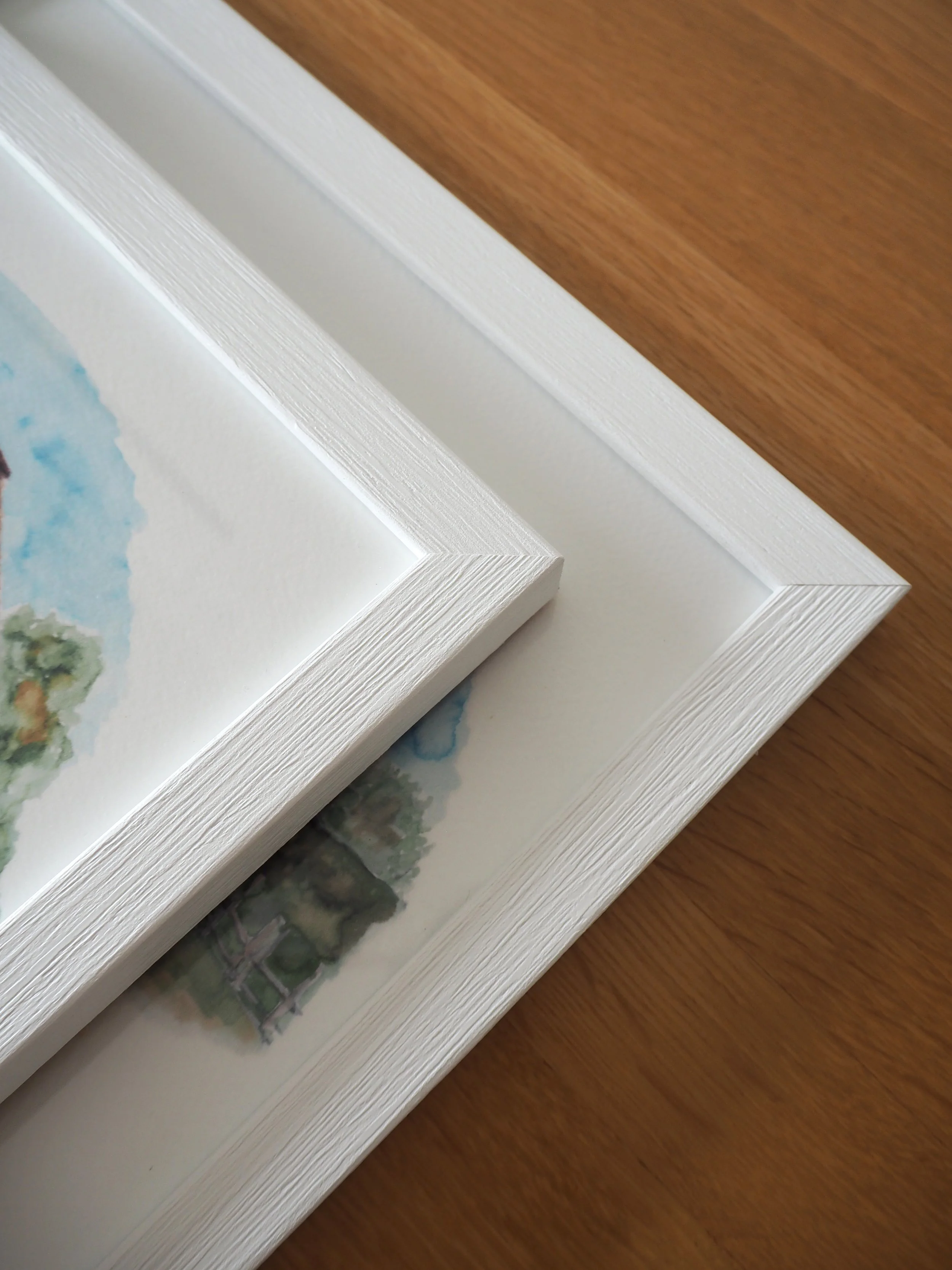 2 white wooden frames