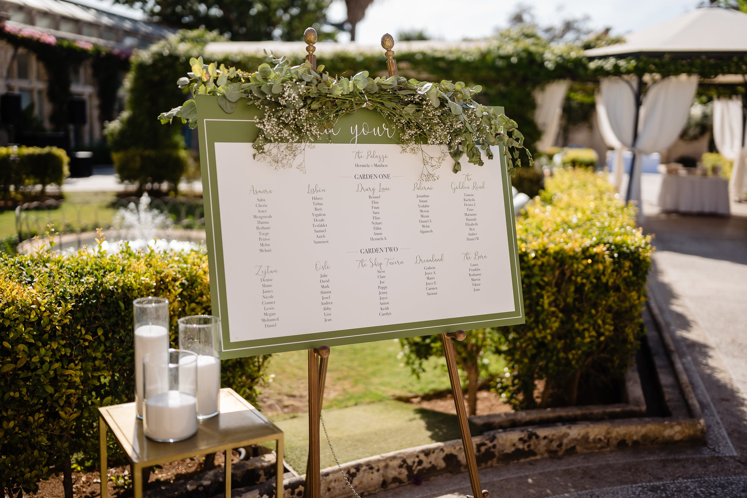 An olive green wedding table plan with foliage. Photo by Shane P. Watts Photography