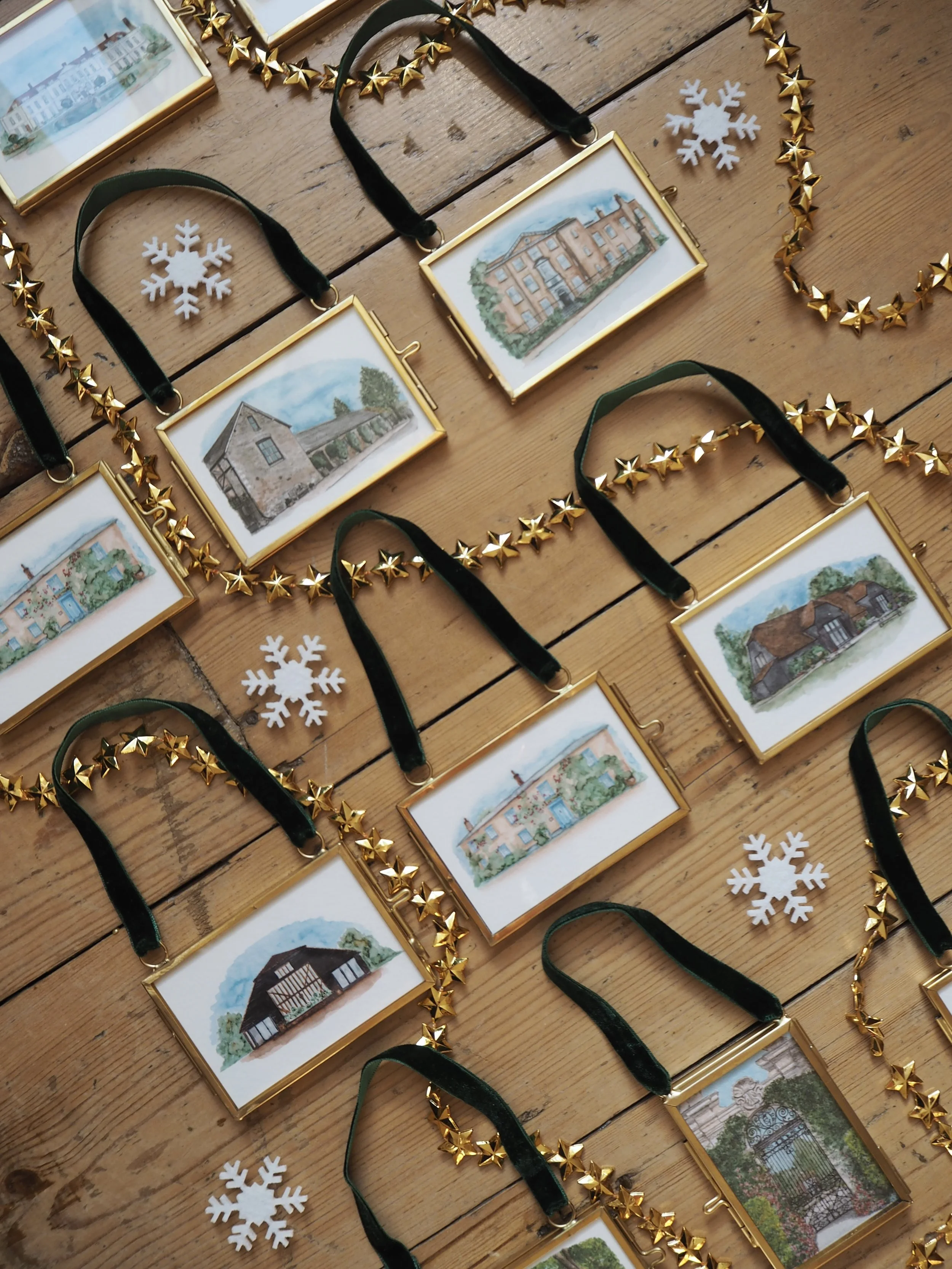 a collection of heirloom wedding venue illustration christmas decorations on wooden floor