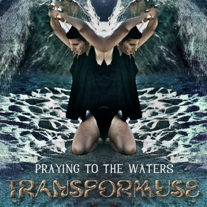 A mirrored image of Ayam kneeling on the ground with water and waves in the background, holding her arms in a praying position. The text reads "Praying to the Waters" and "Transformuse."
