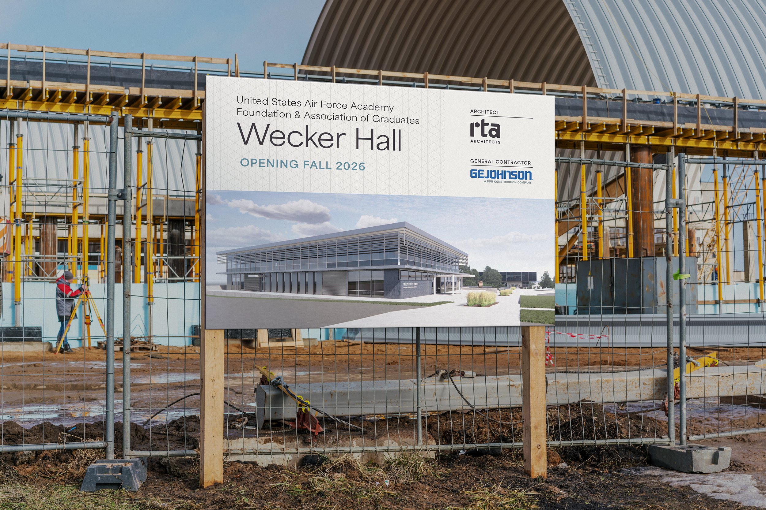 Construction site with scaffoldings and a sign for the new Wecker Hall building at the United States Air Force Academy, scheduled to open fall 2026.