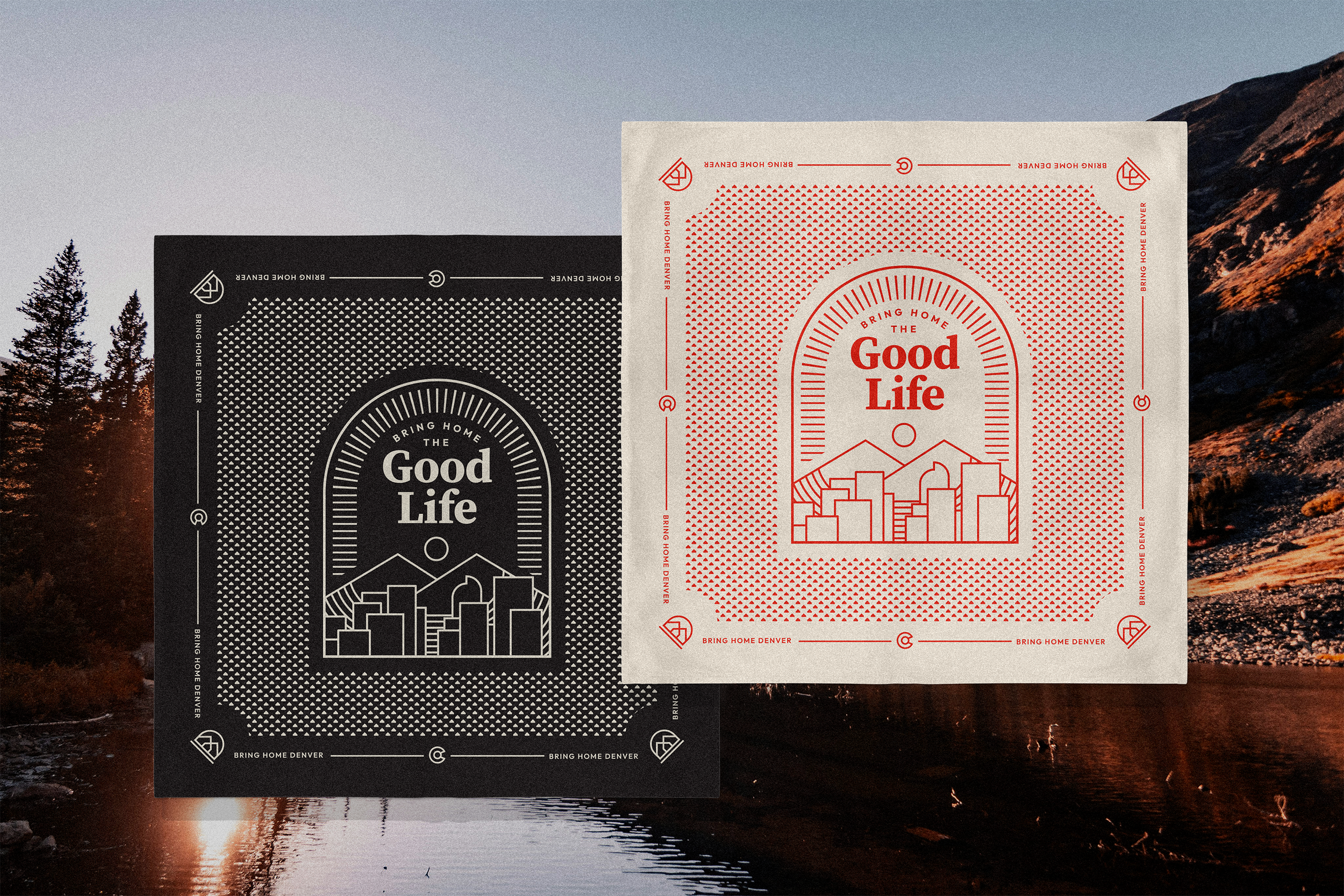 Two promotional paper cards for Denver with a cityscape illustration and text saying 'Bring Home Denver' and 'The Good Life,' one in black and white, the other in red on white background, over a mountain lake scene at sunset.