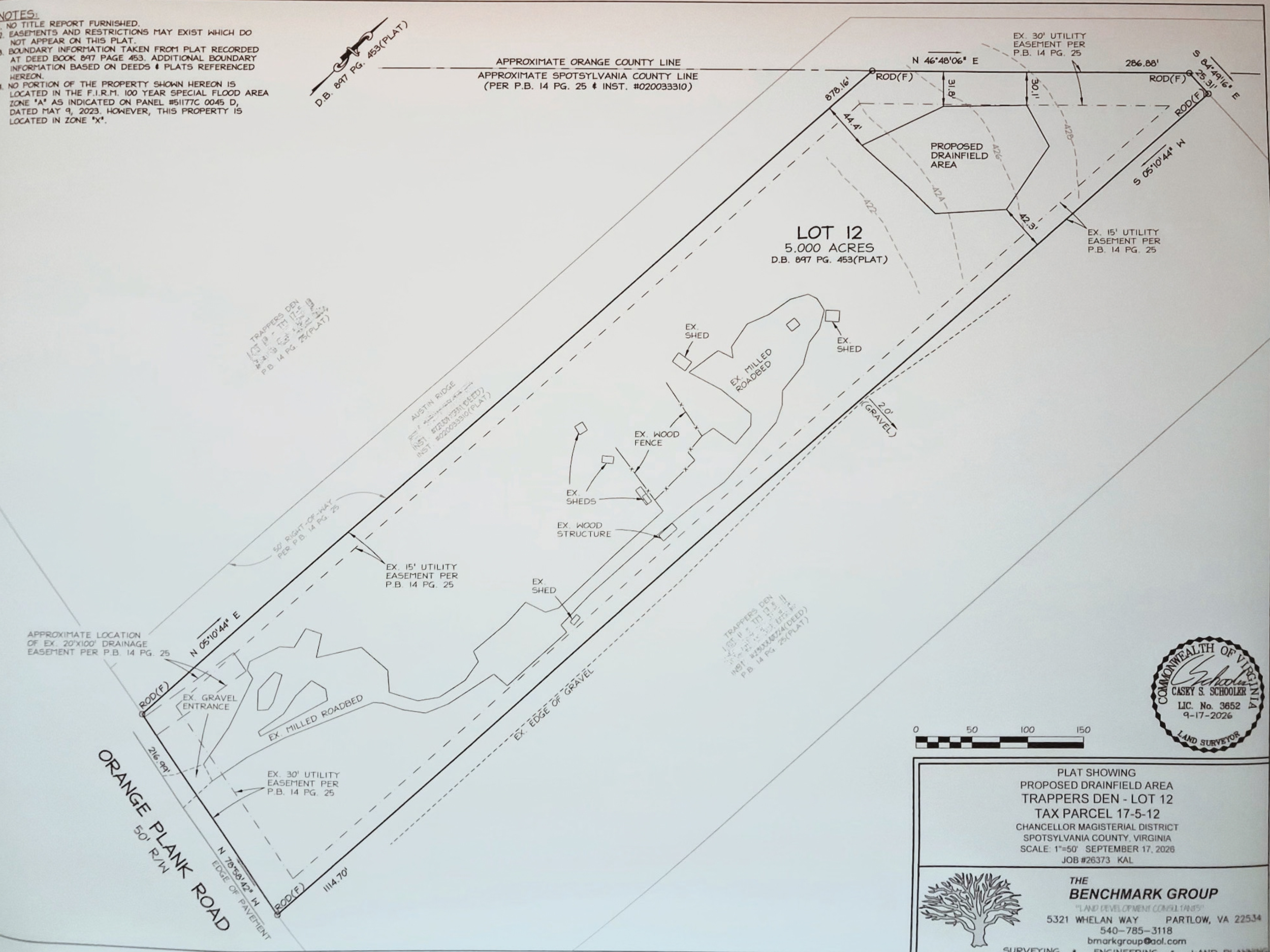 A detailed land survey map showing lot boundaries, driveways, structures, utility easements, proposed drainfield area, and county lines in a land development project in Virginia.