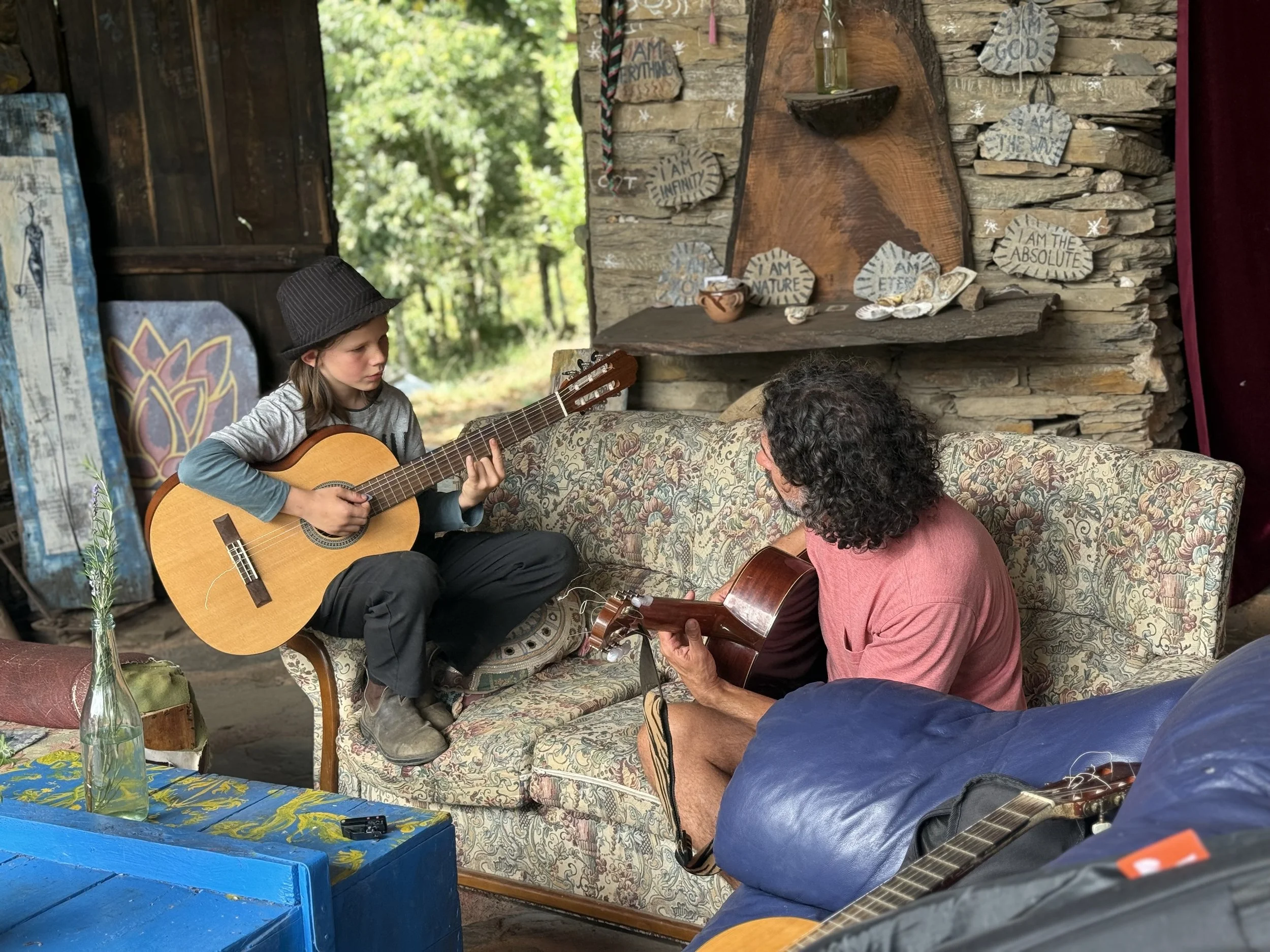 Father and son playing guitar