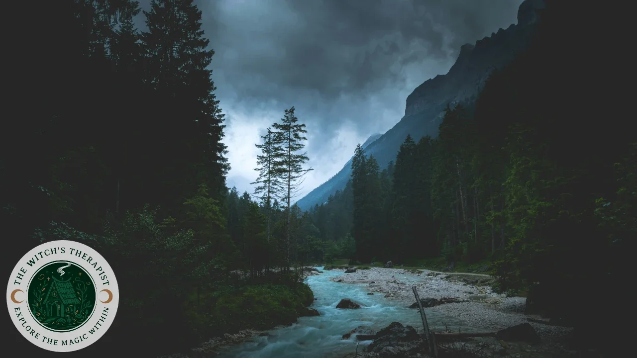 a dark forest and creek, with a mountain range and a cloudy sky in the background